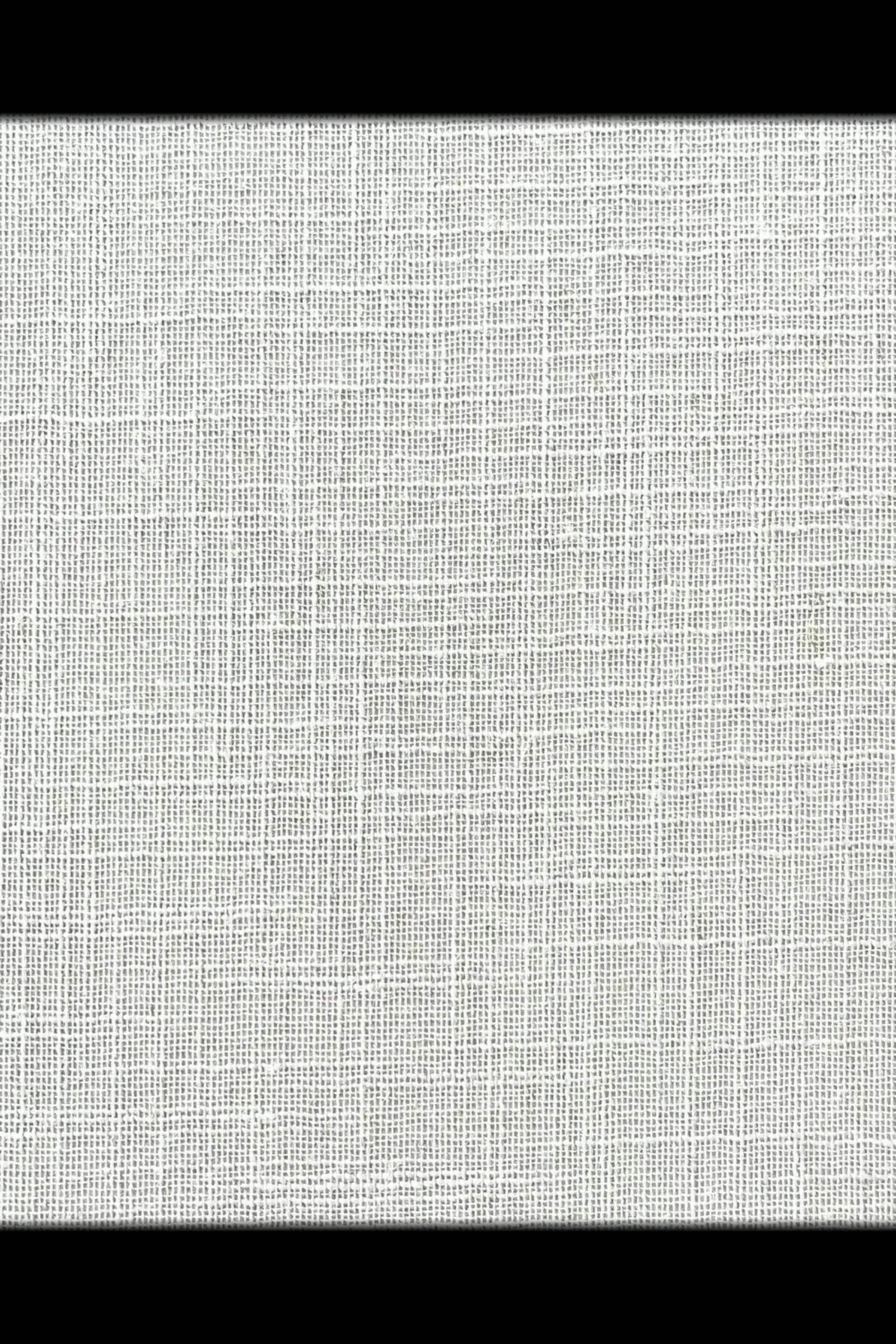 Close-up of white woven fabric texture, ideal for luxury interior finishing.