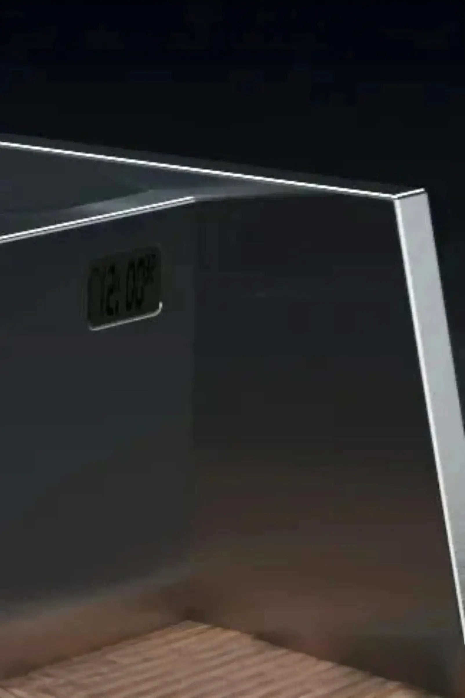 close-up of modern glass or acrylic display case with built-in digital thermometer