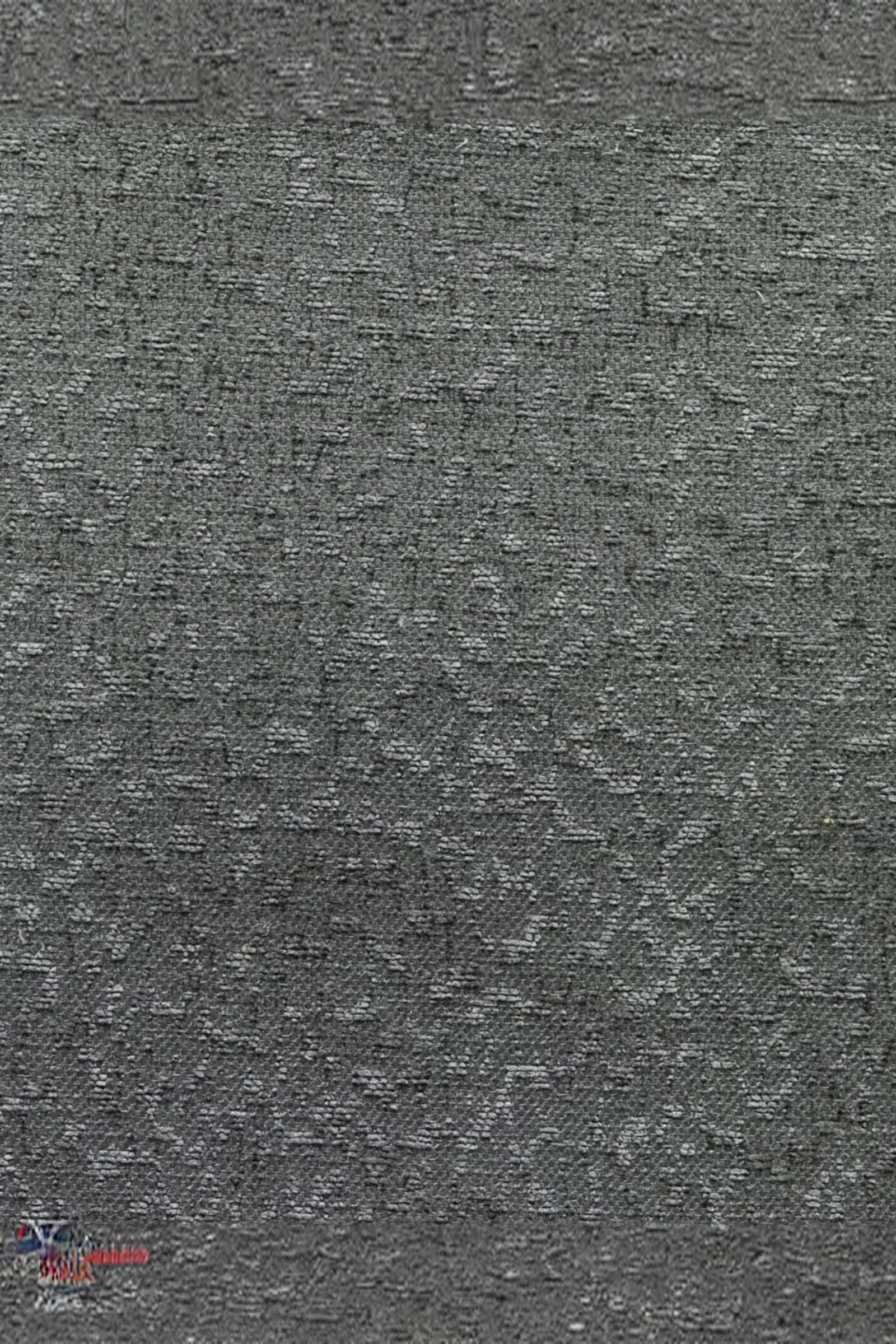 Close-up of textured grey fabric with subtle geometric pattern for luxury interior design