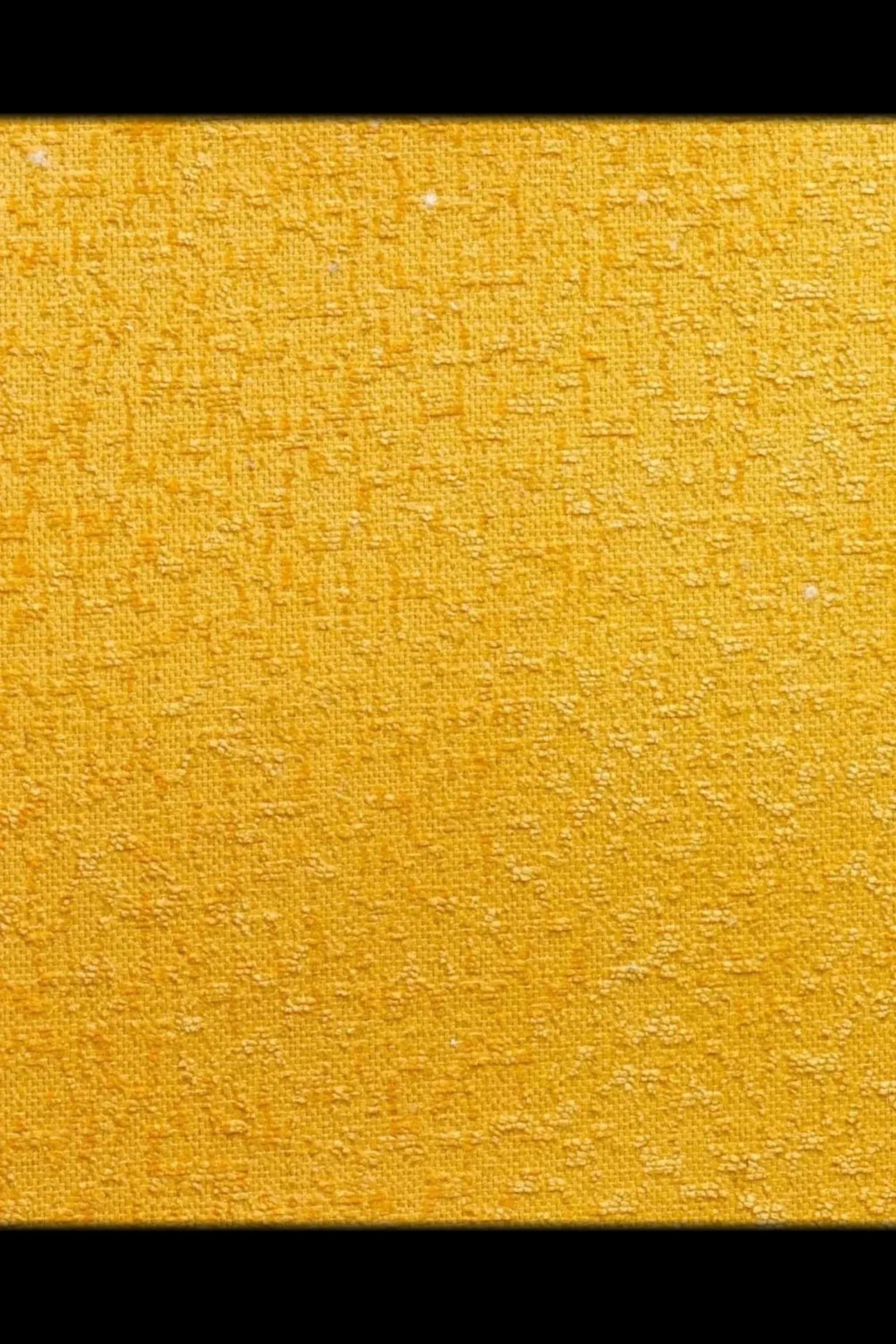 Yellow textured fabric closeup, upholstery textile with woven pattern