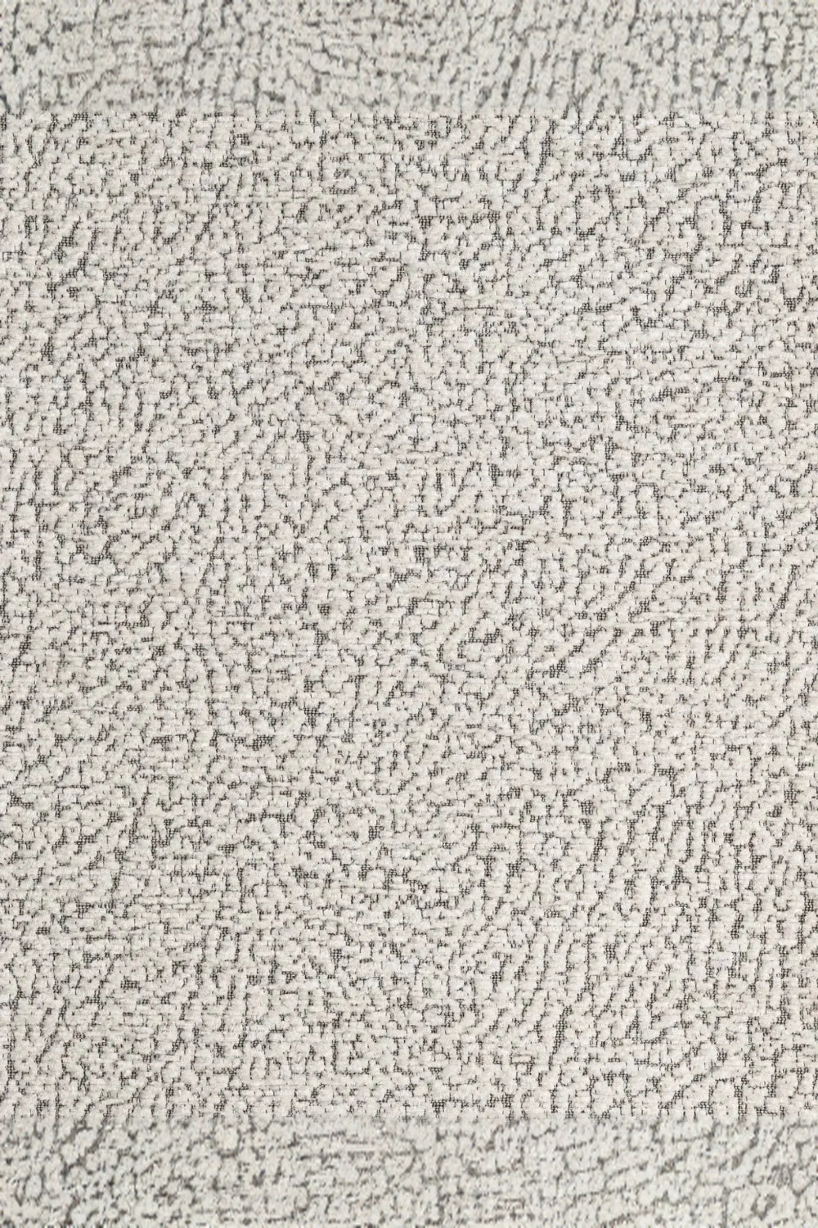 Close-up of textured light grey and white boucle fabric with subtle abstract pattern.