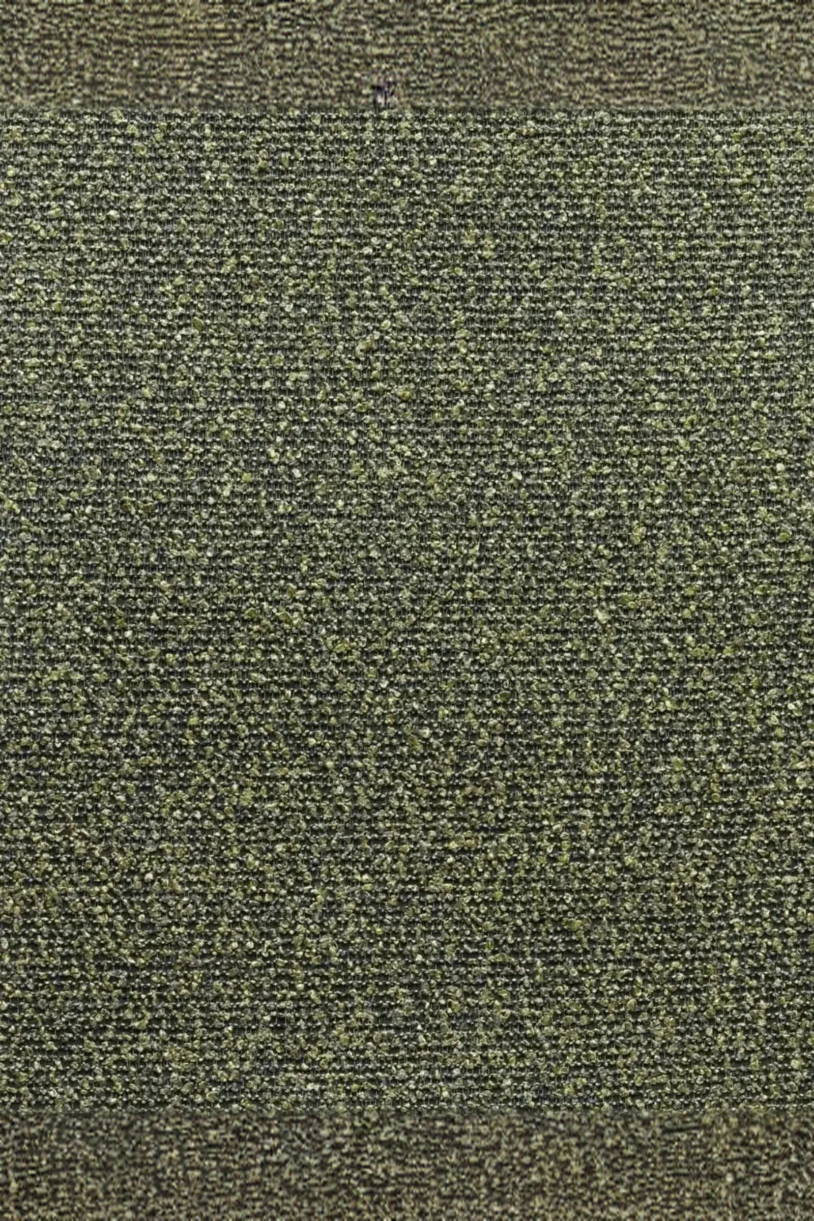 Close-up of textured green and black woven upholstery fabric pattern