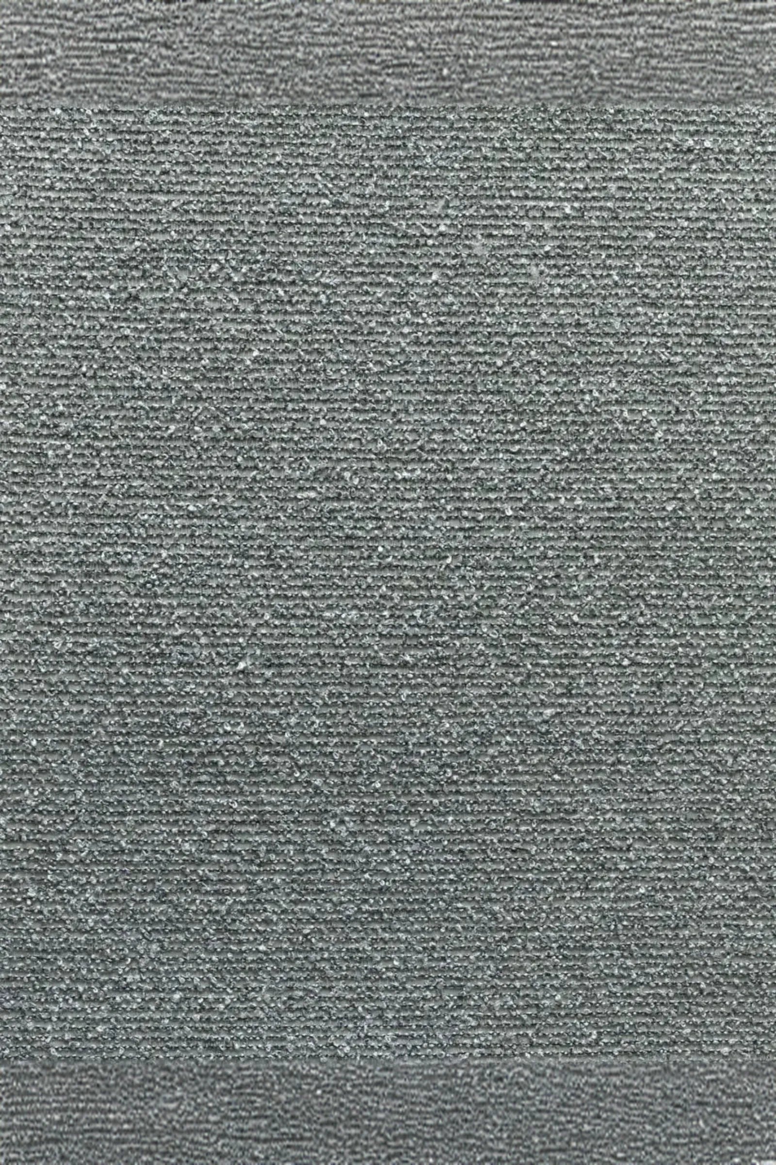 Close-up of textured grey fabric with fine horizontal lines, suitable for luxury interiors