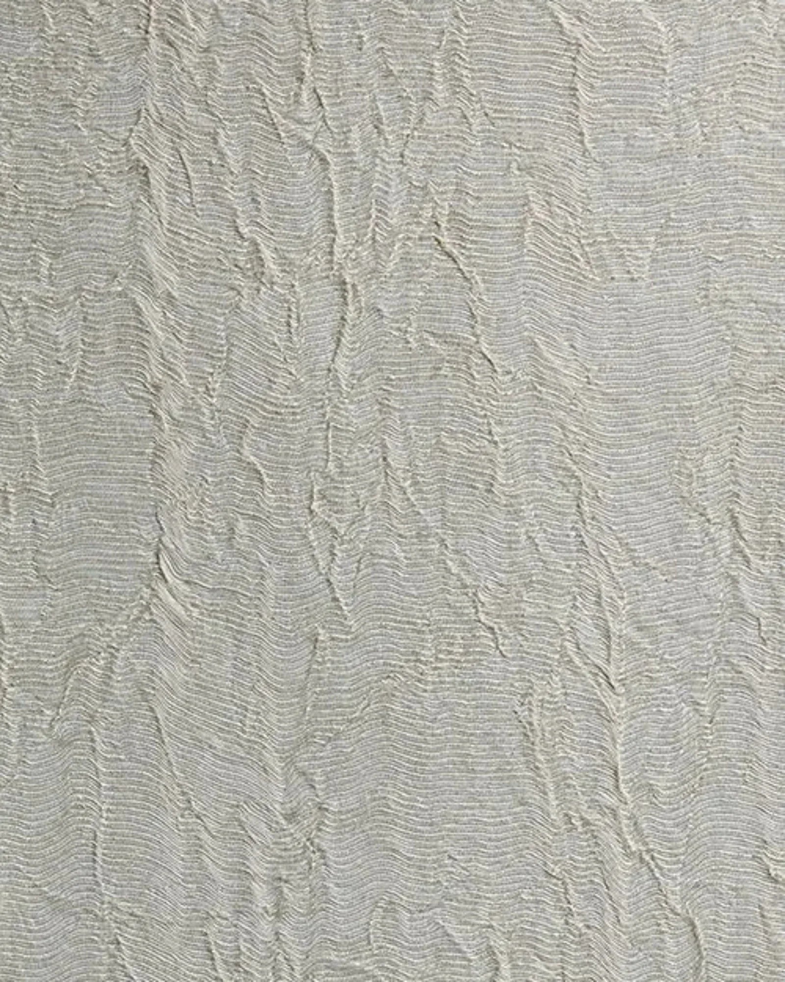 Textured light grey wall finish with organic, wavy pattern and subtle sheen