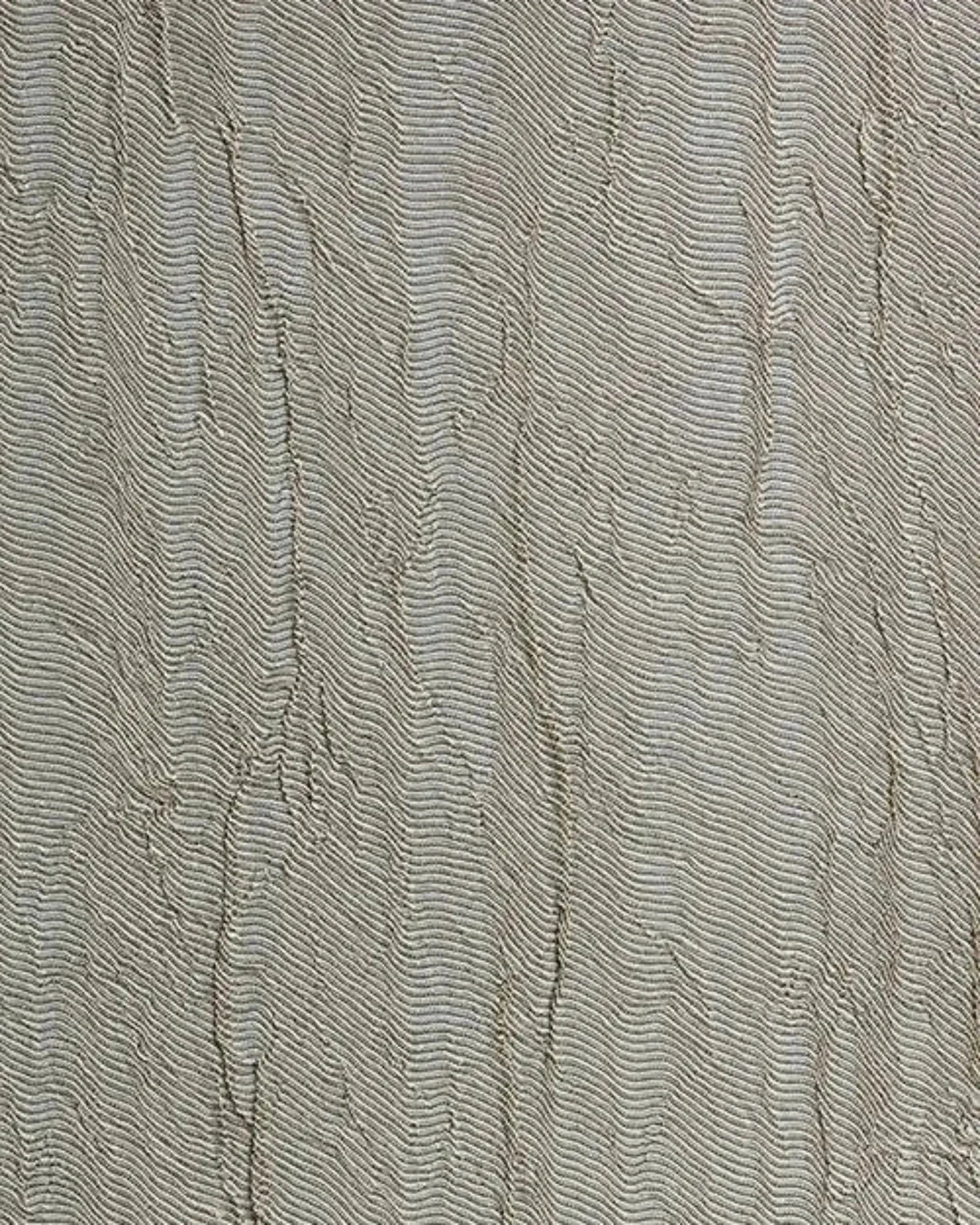 Textured beige wall surface with organic wave pattern, luxury interior design detail