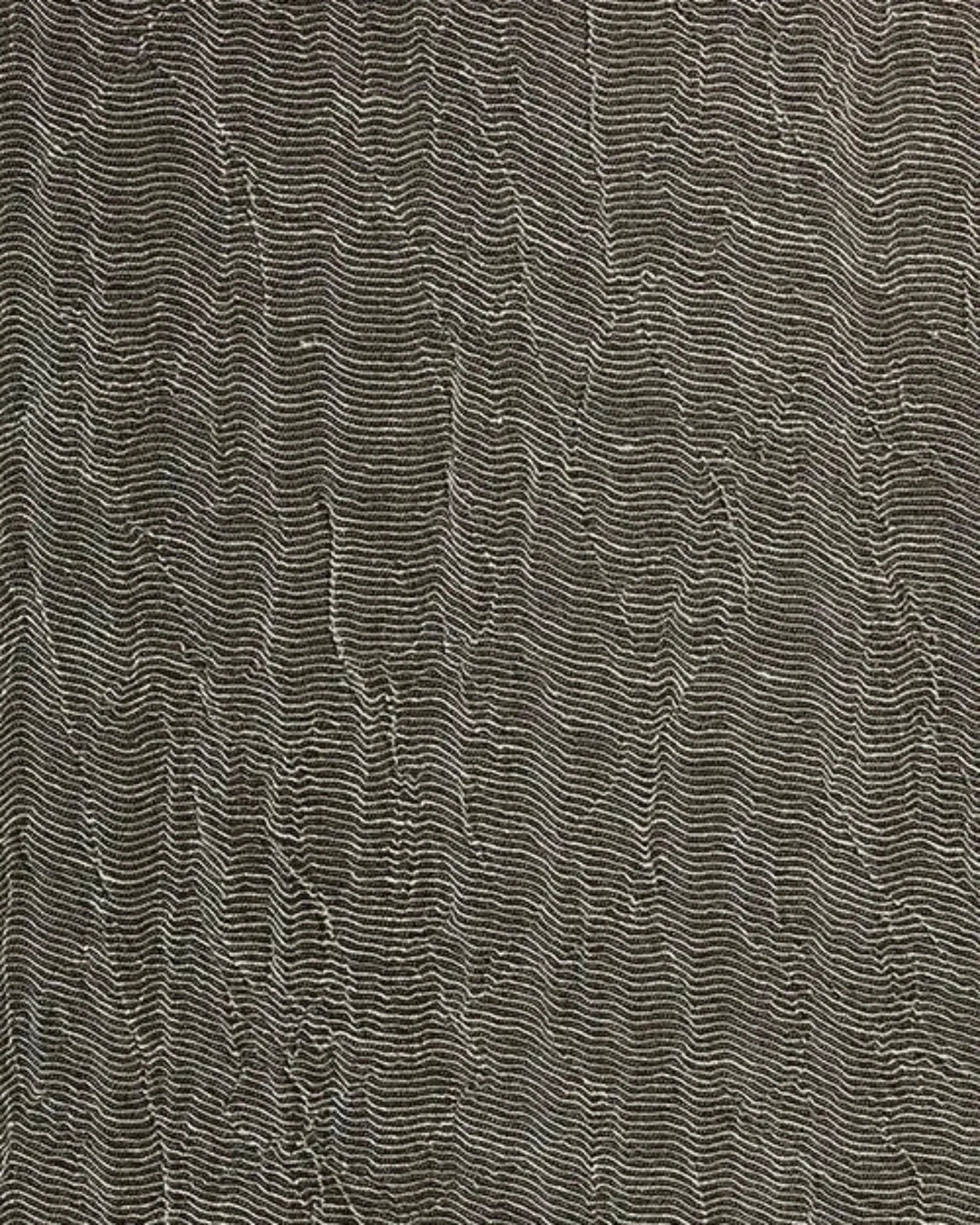 Textured wall surface with intricate wavy lines in neutral tones, luxury interior detail