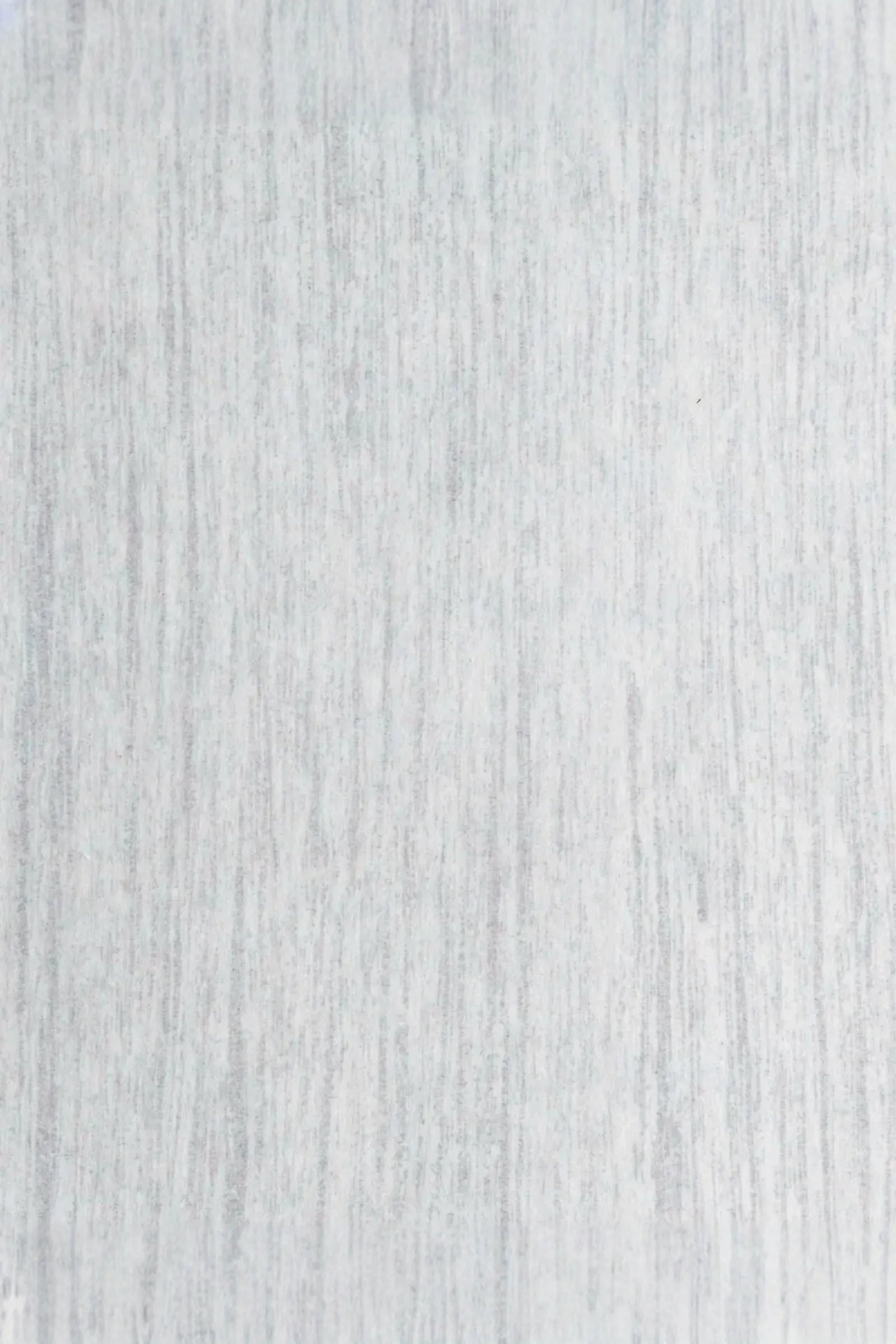 Light grey textured bedding fabric with subtle linear pattern, ideal for luxury interiors.