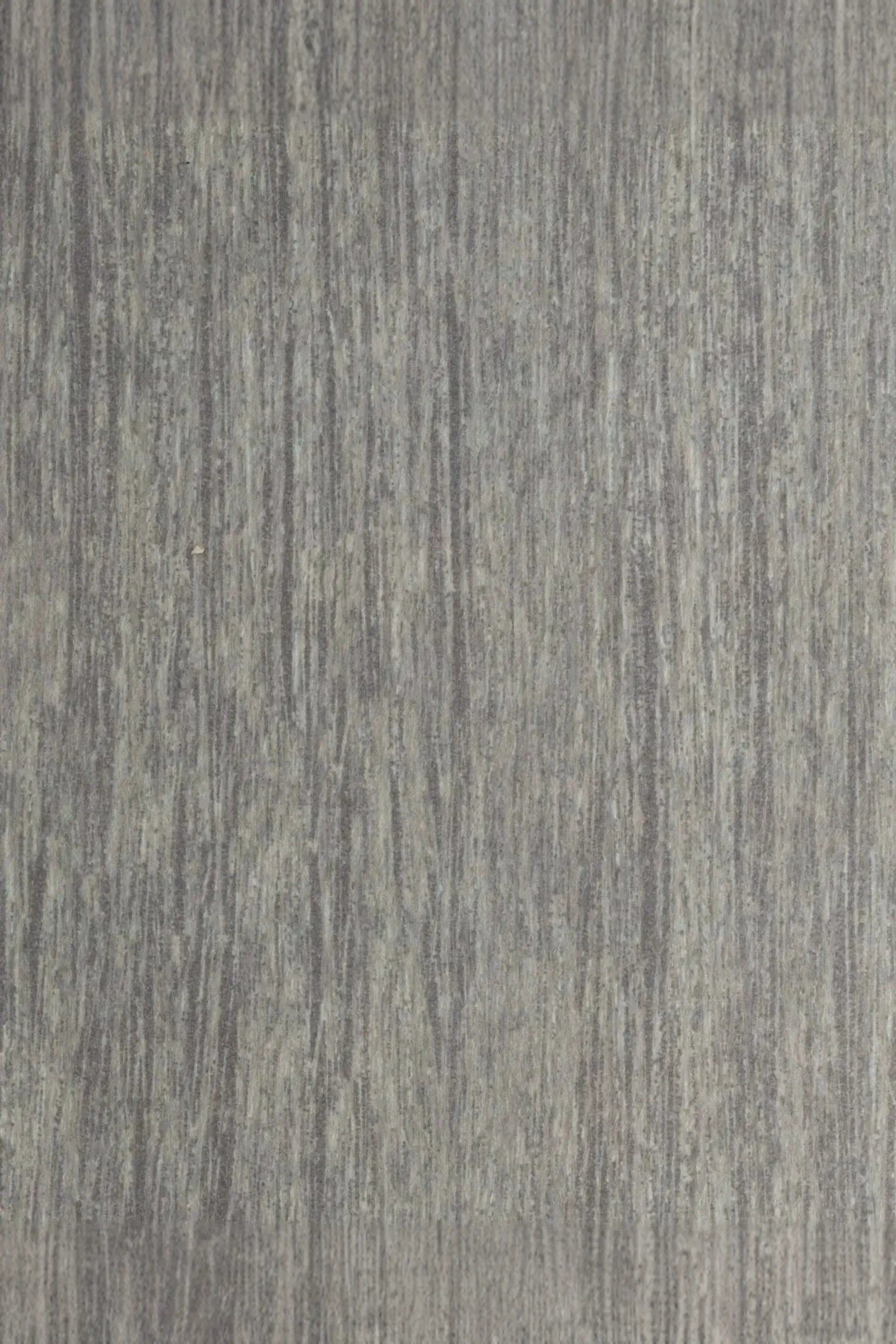 Close-up of grey woven textile fabric with subtle vertical stripe texture