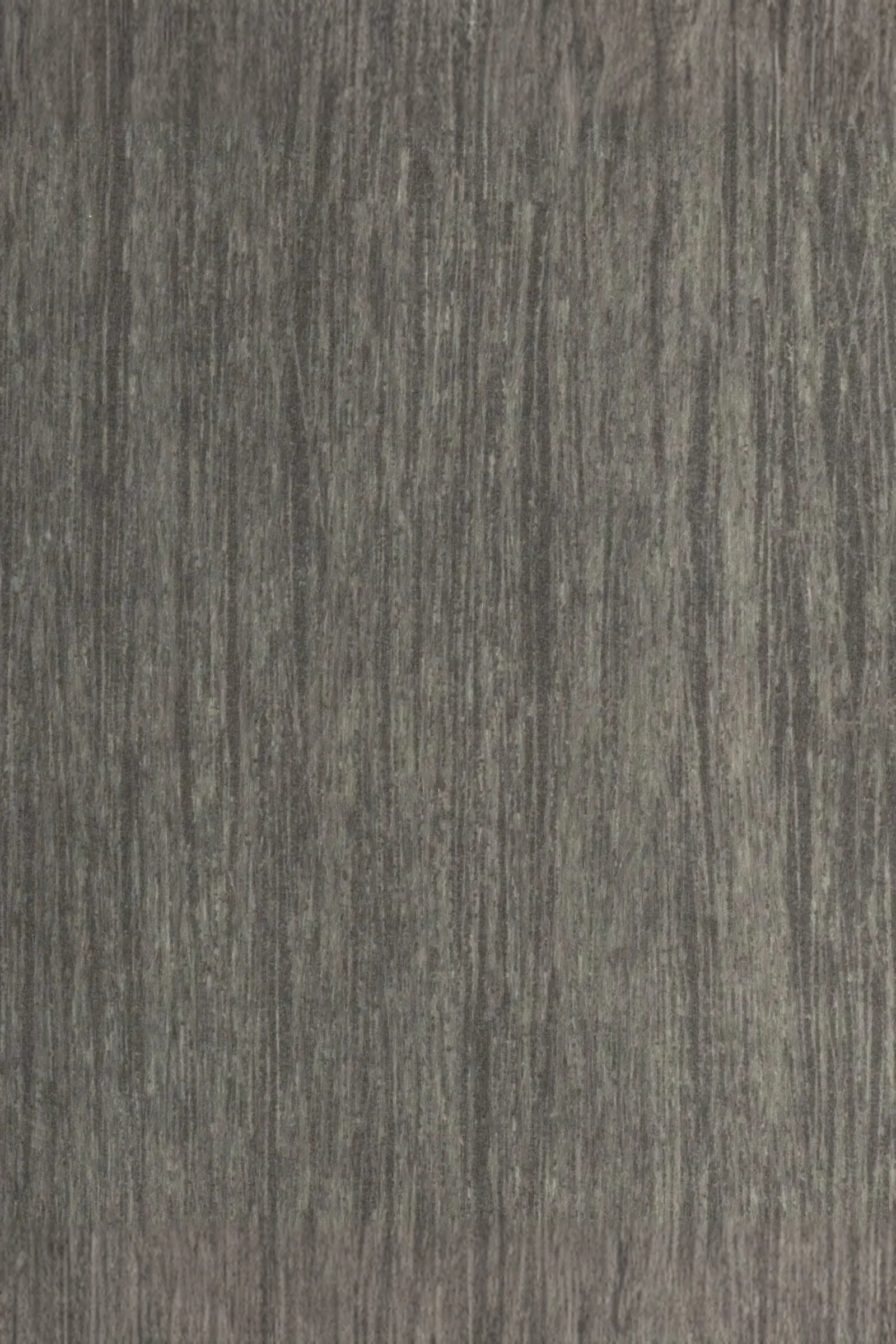Close-up of textured gray wood surface with natural vertical grain pattern