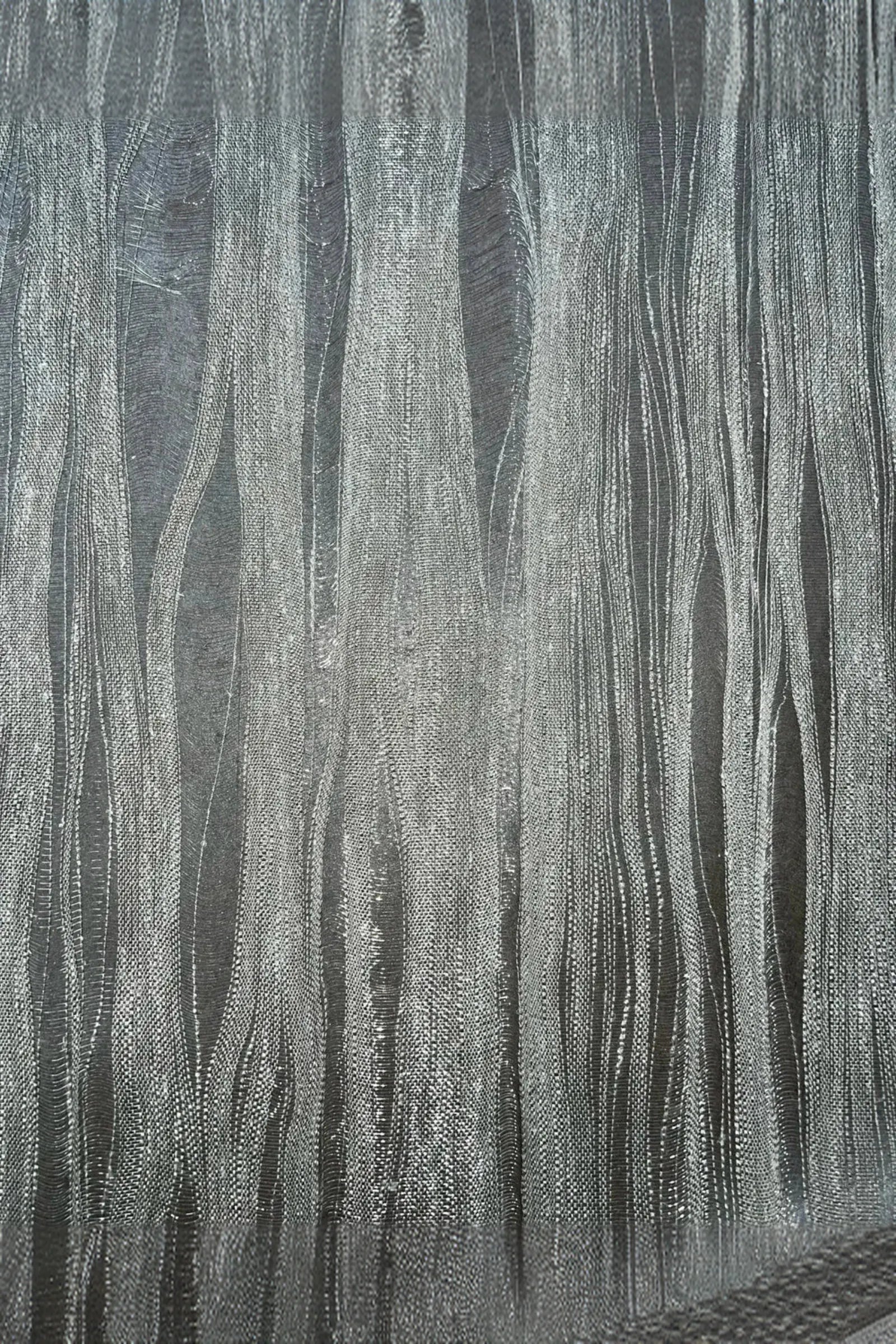 Abstract textured wall panel with vertical silver metallic lines on a dark background
