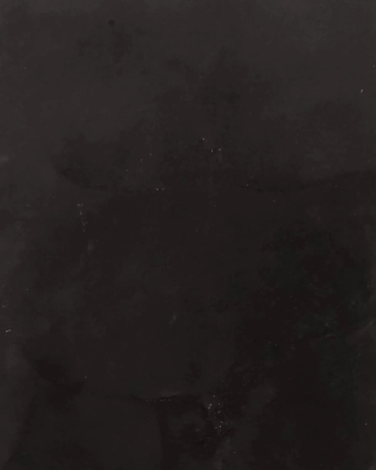 Black marble surface with subtle veining, luxury interior design material