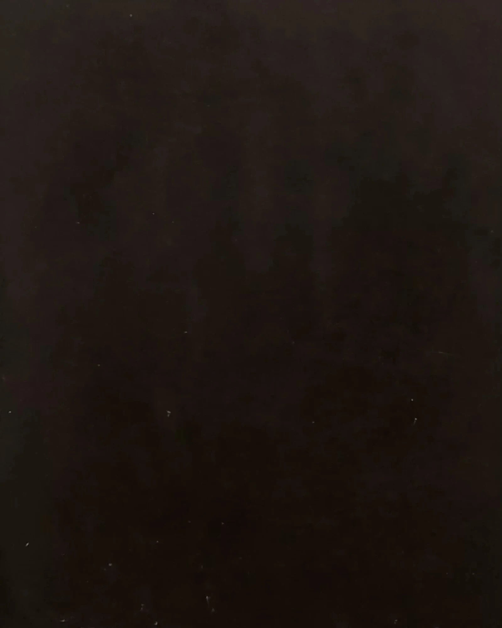 Dark brown wood surface texture, matte finish, luxury interior material sample