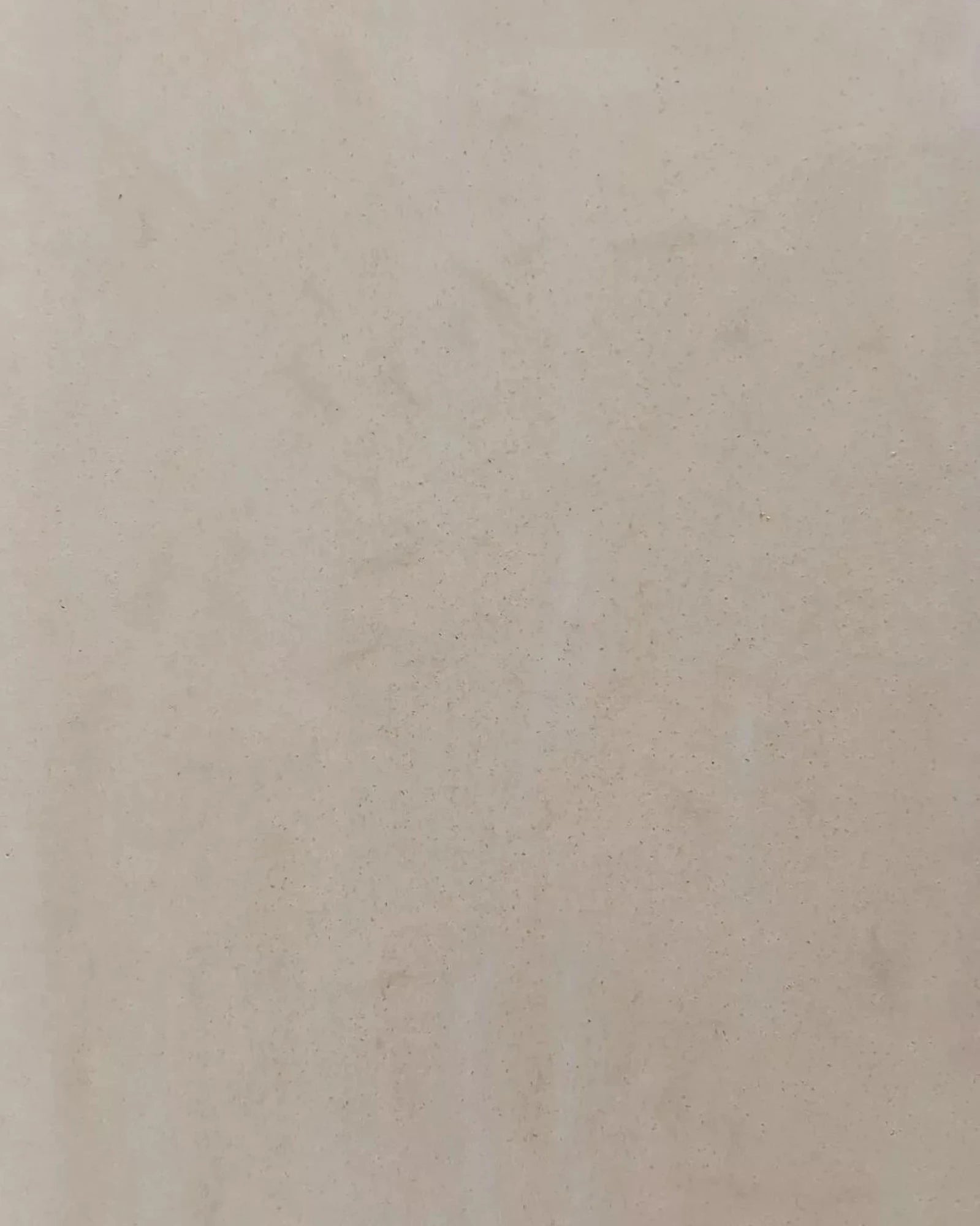 Beige textured wall surface with subtle speckles, luxury interior finish