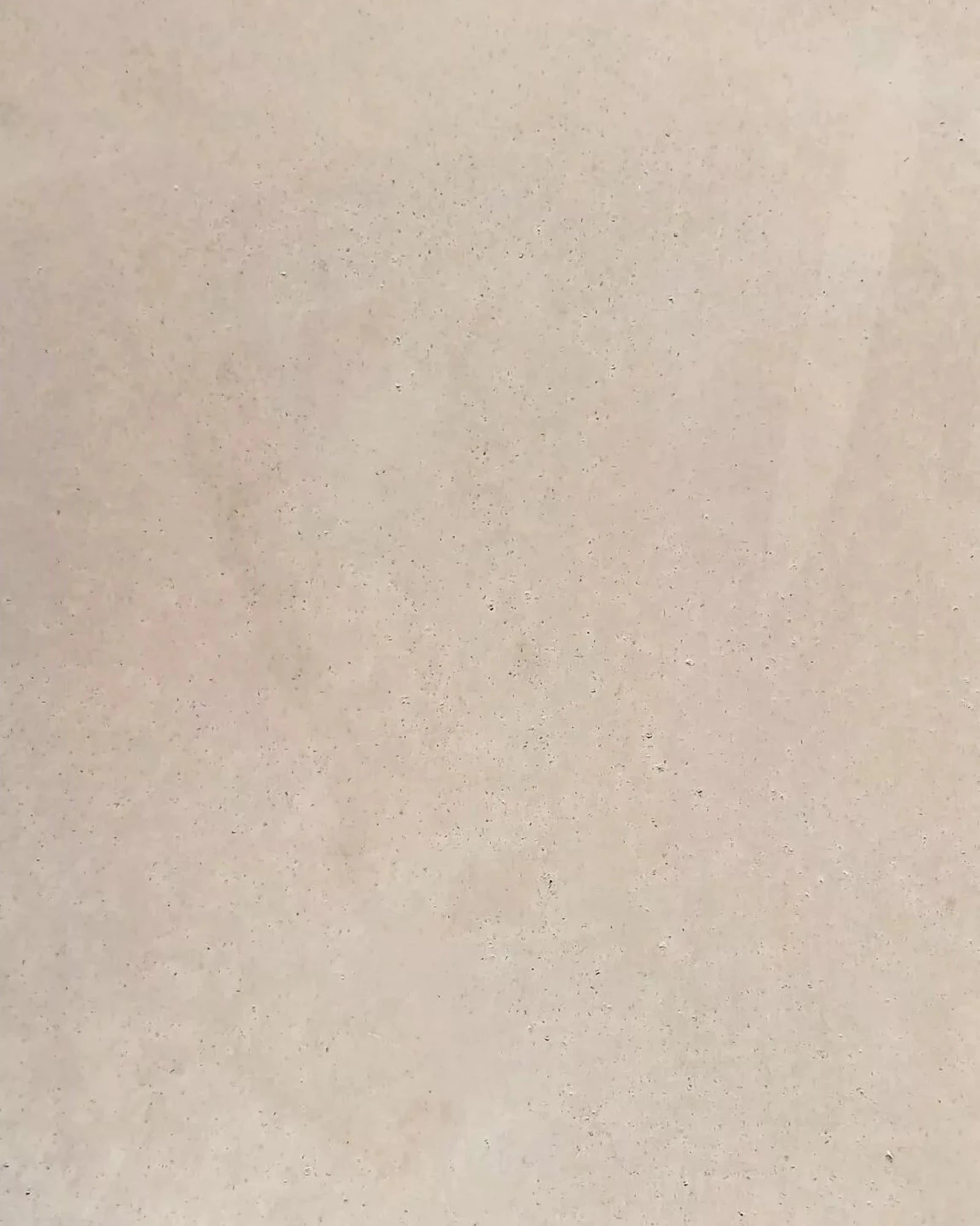 Close-up of light beige stone texture, ideal for luxury interior surfaces