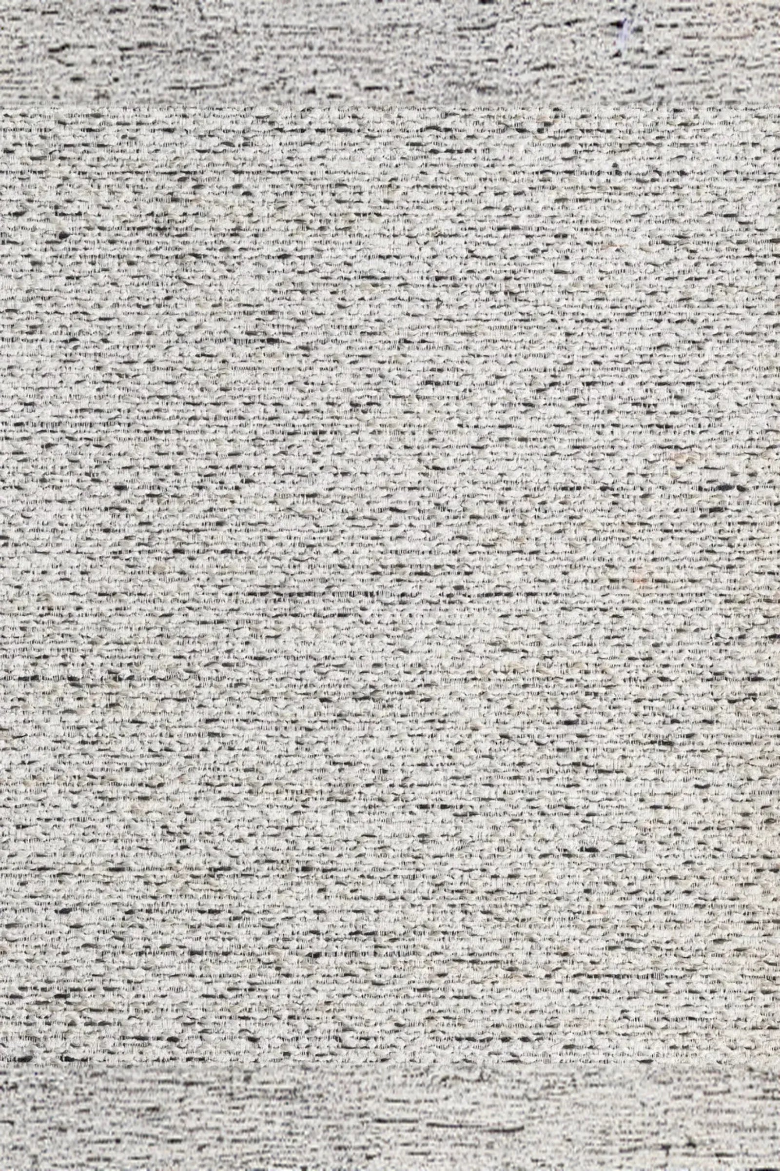 close-up of textured light grey woven upholstery fabric for luxury interiors