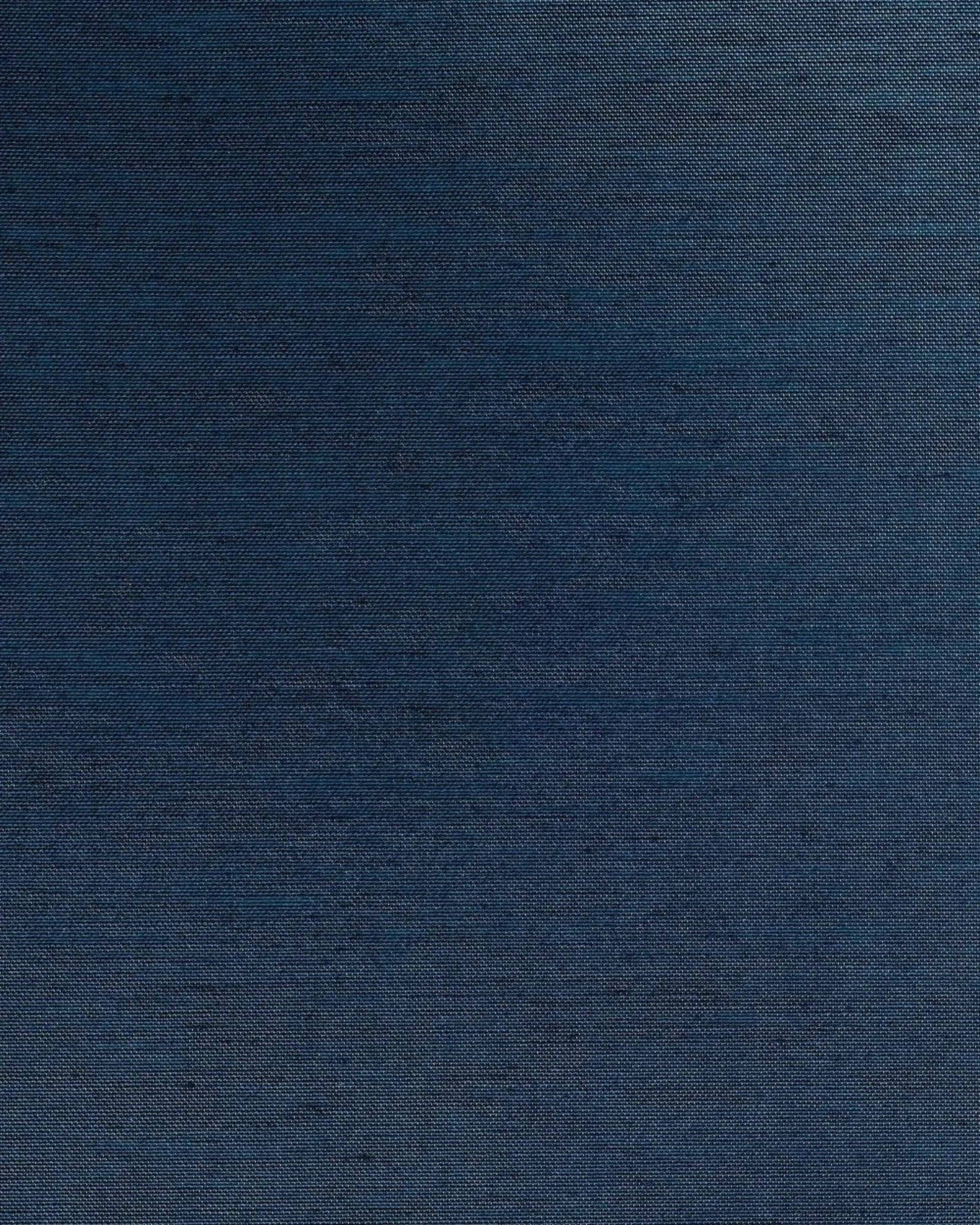 Close-up of textured dark blue woven fabric, ideal for luxury interior upholstery.