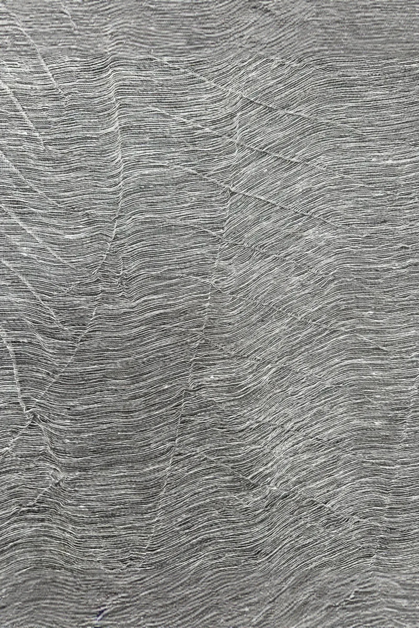 Textured grey stone surface with natural linear patterns for luxury interior design