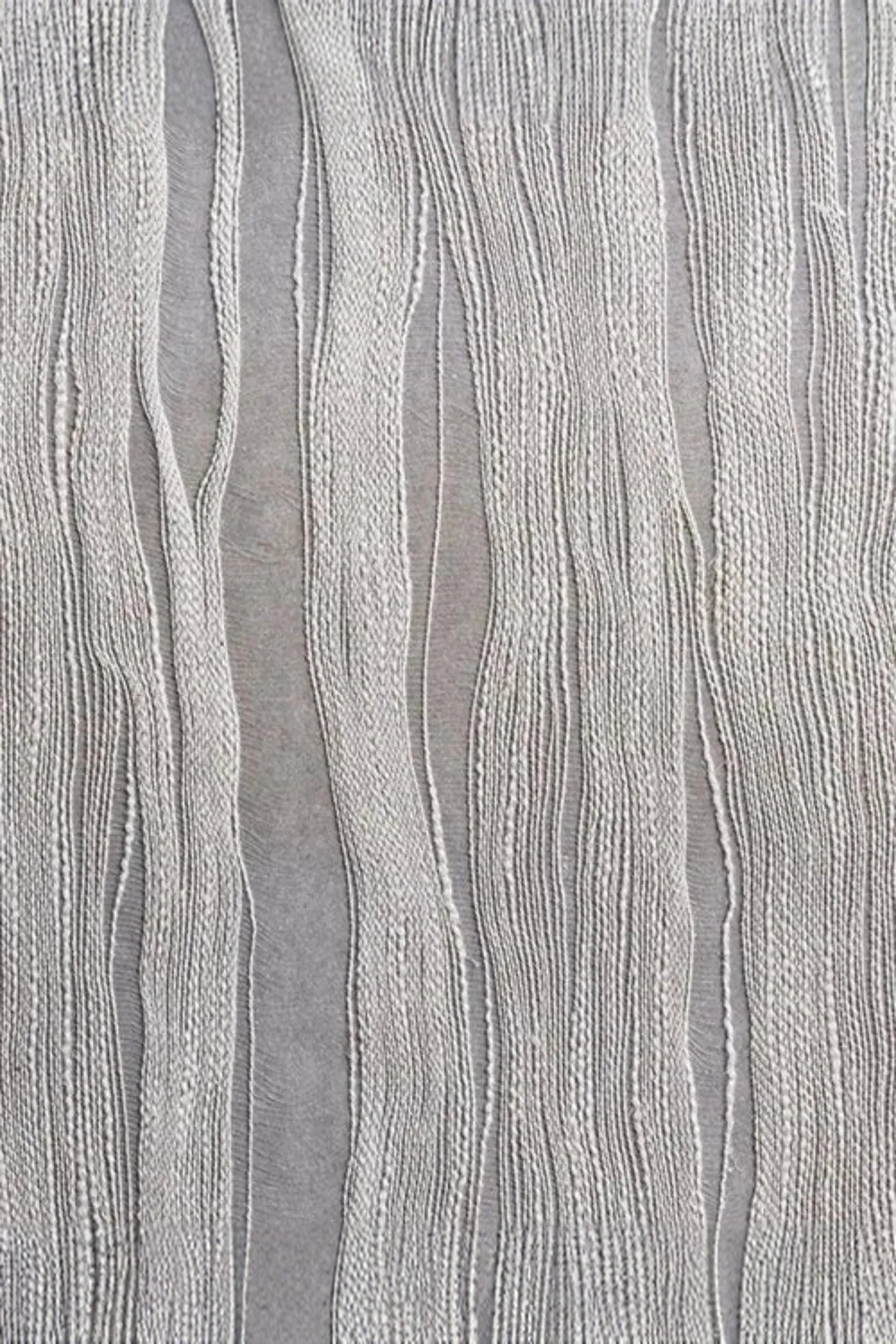 Textured fabric with vertical wavy cream threads on a light grey background, luxury interior textile