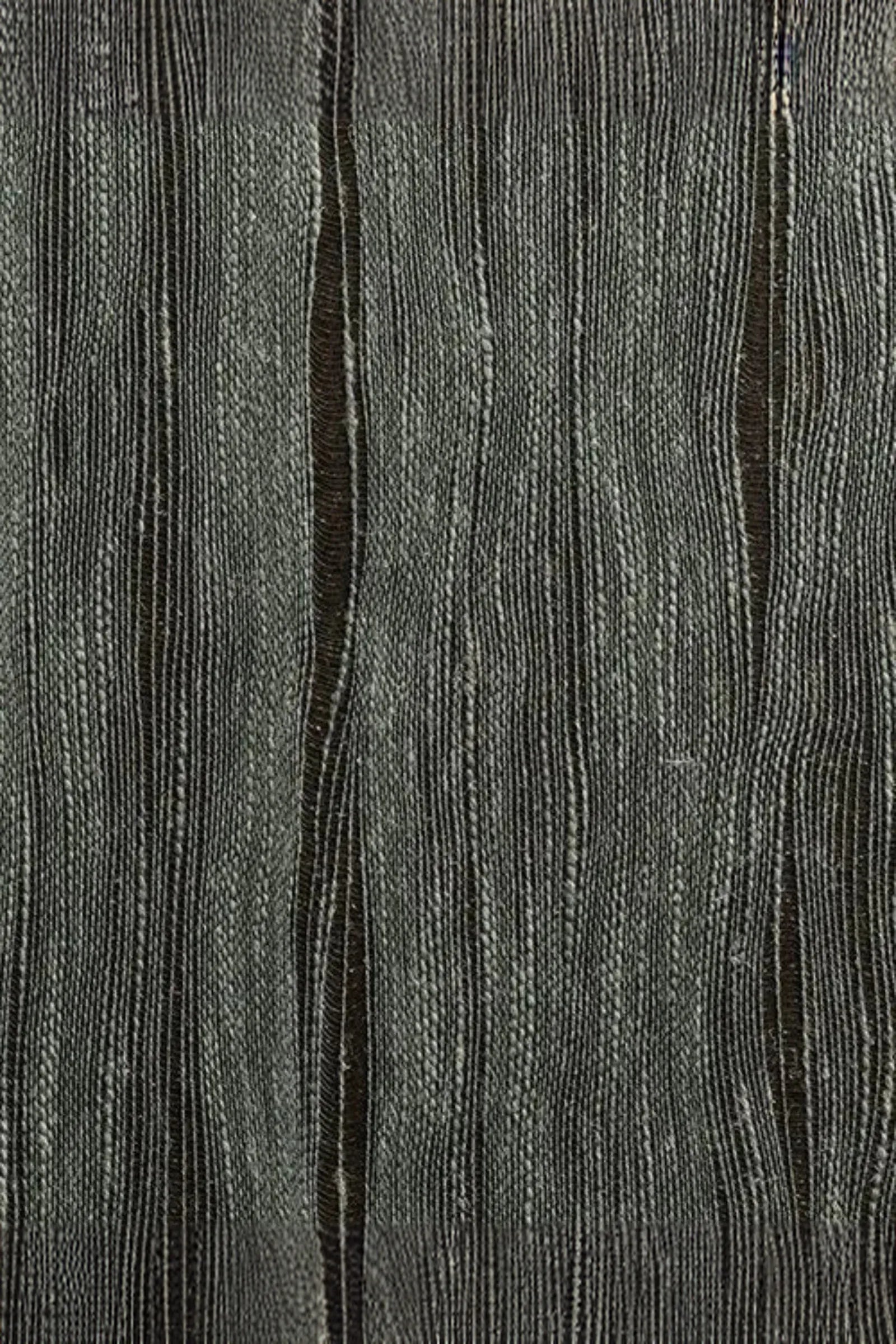 Textured grey woven fabric with vertical wave pattern, luxury interior textile sample