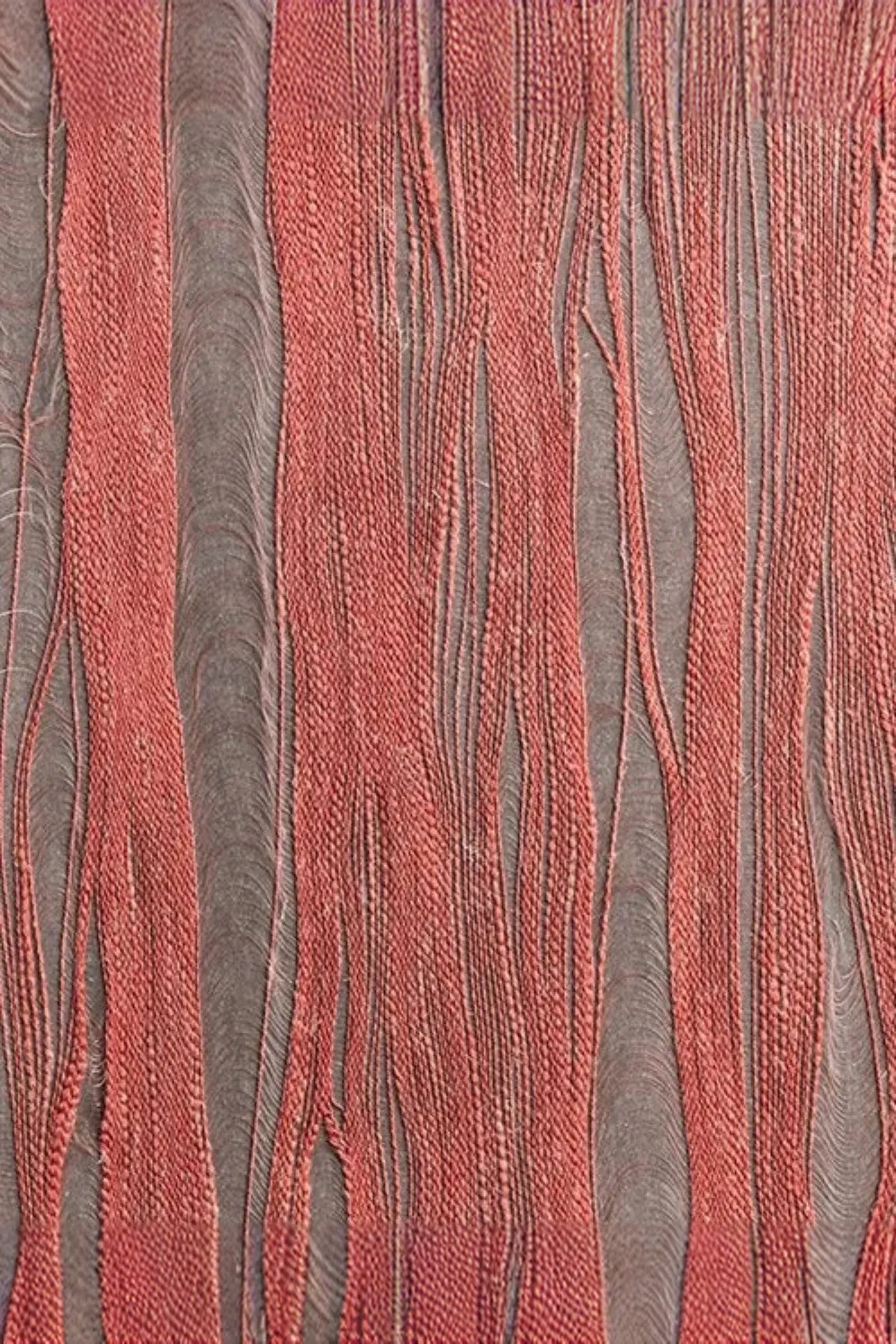 close-up of luxury red and gray woven textile with textured vertical lines