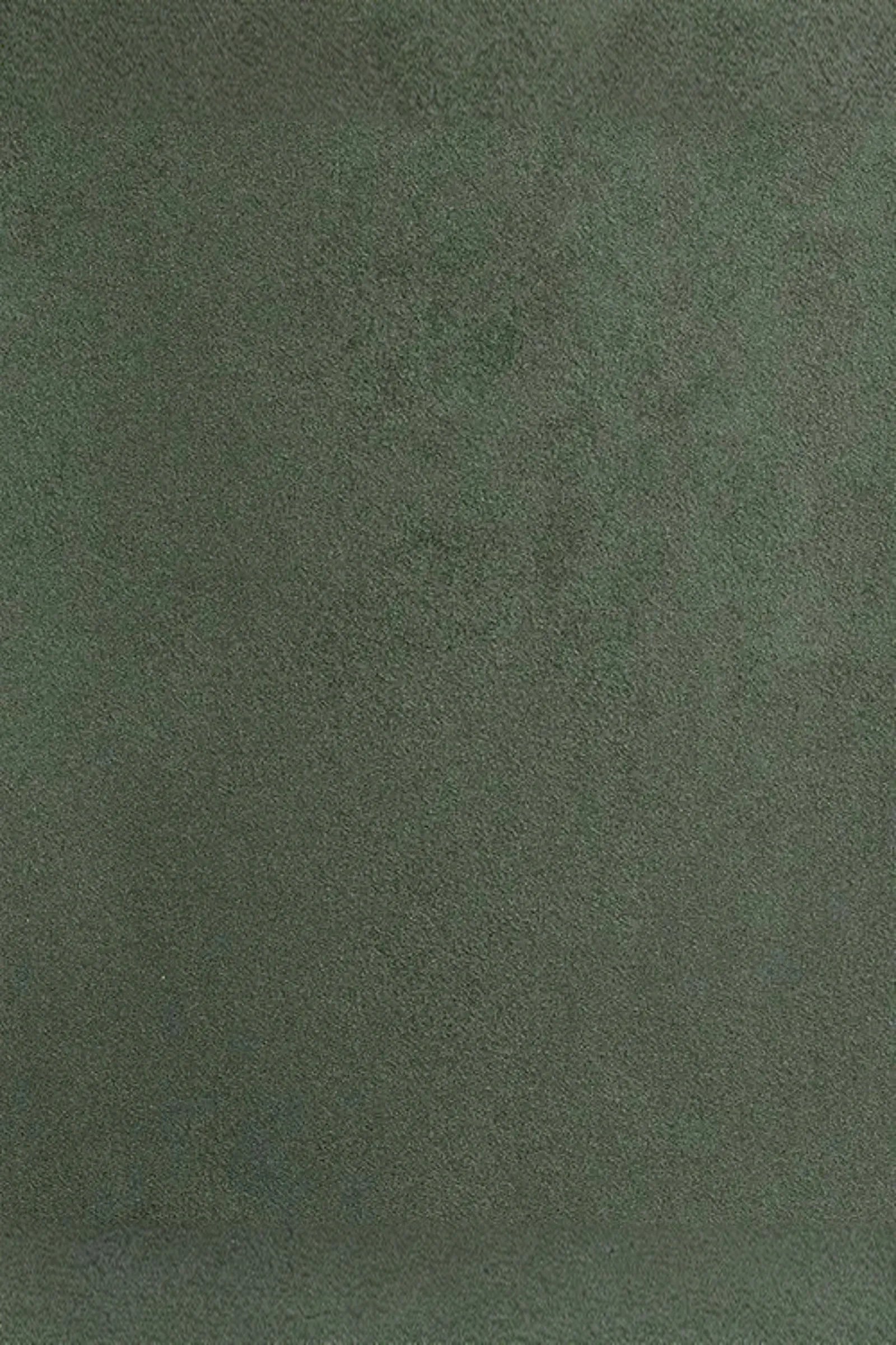Close-up of green suede fabric texture for luxury interior design