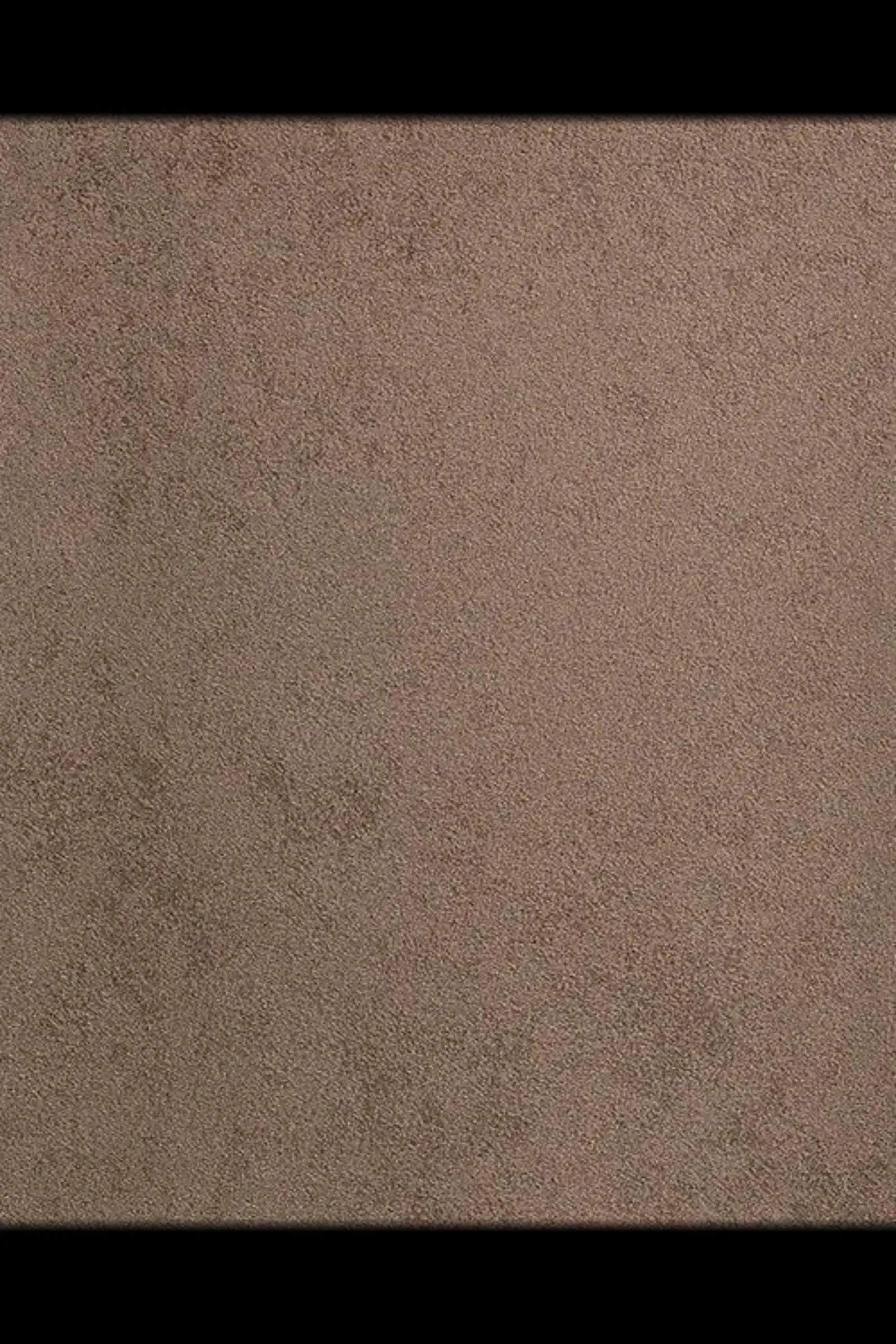 Close-up of taupe suede fabric texture with subtle brown and grey tones
