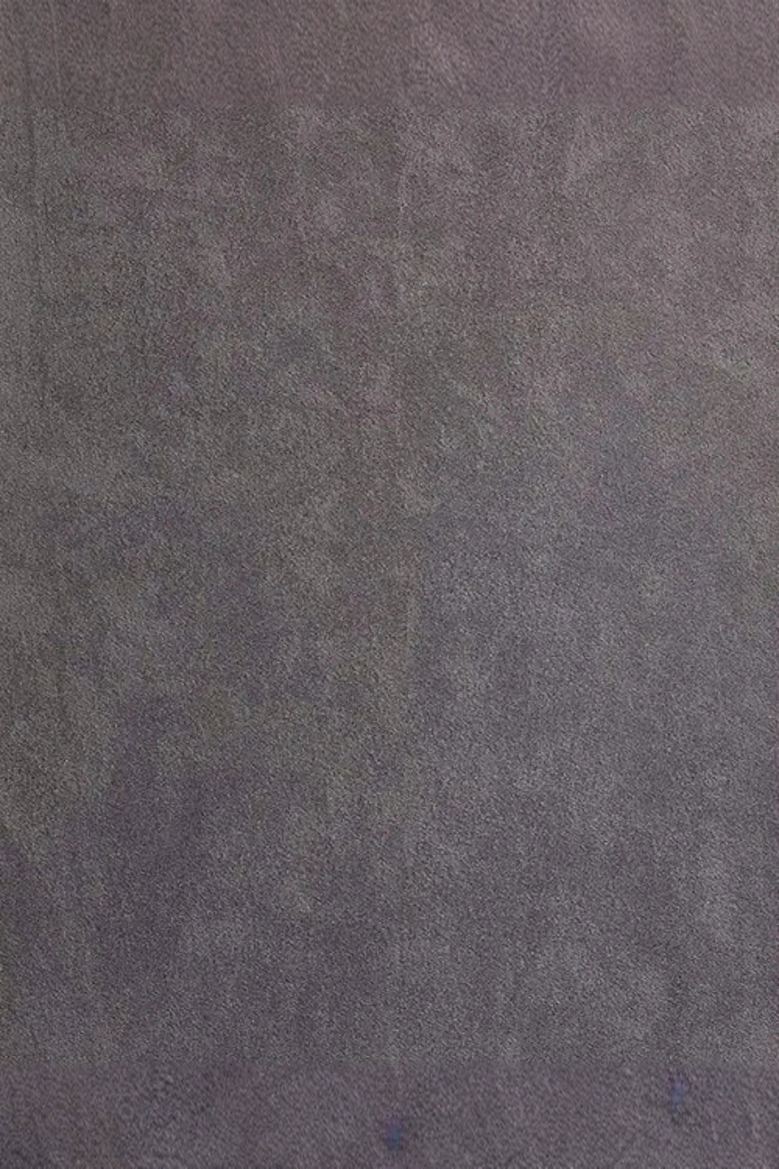 Gray suede fabric texture with a soft, matte finish and subtle shading variations