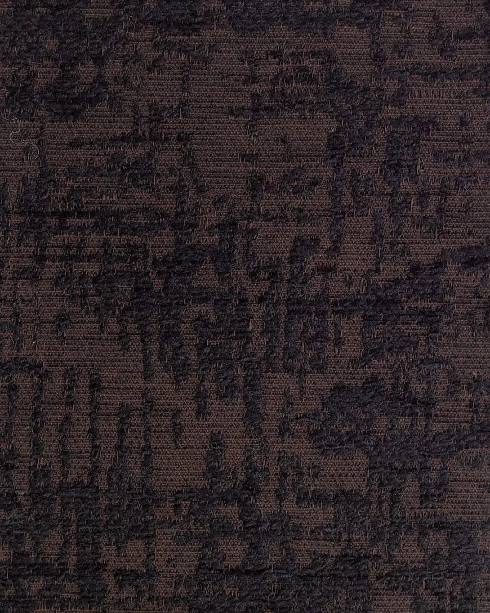 Close-up of textured brown and black woven upholstery fabric with abstract pattern