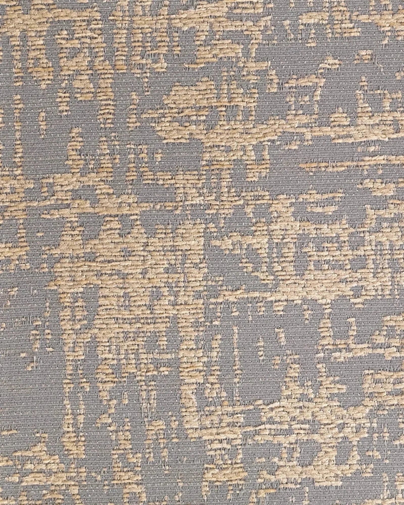 Close-up of textured woven fabric with beige and gray abstract pattern