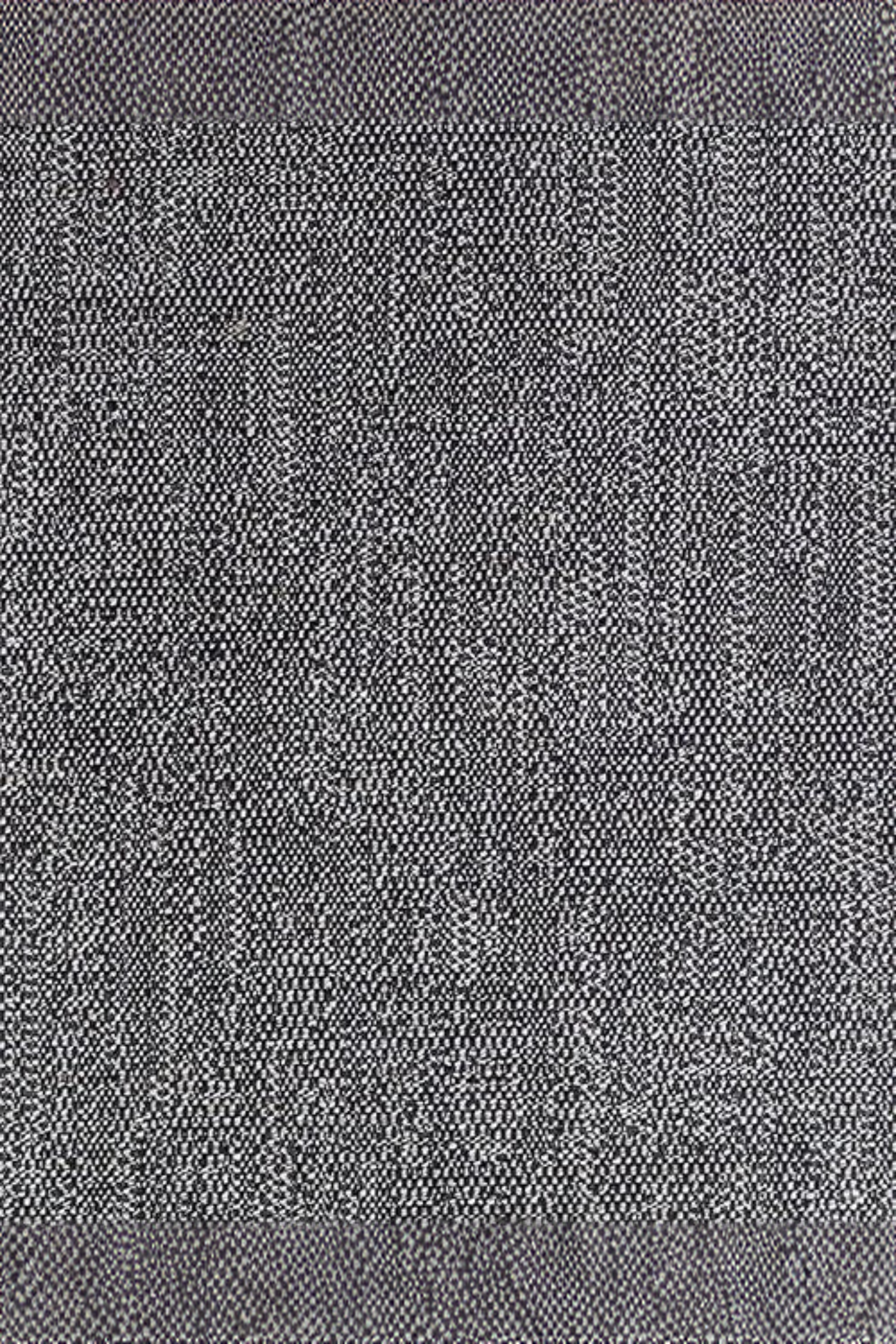 Close-up of grey and white woven textile fabric with a textured pattern.
