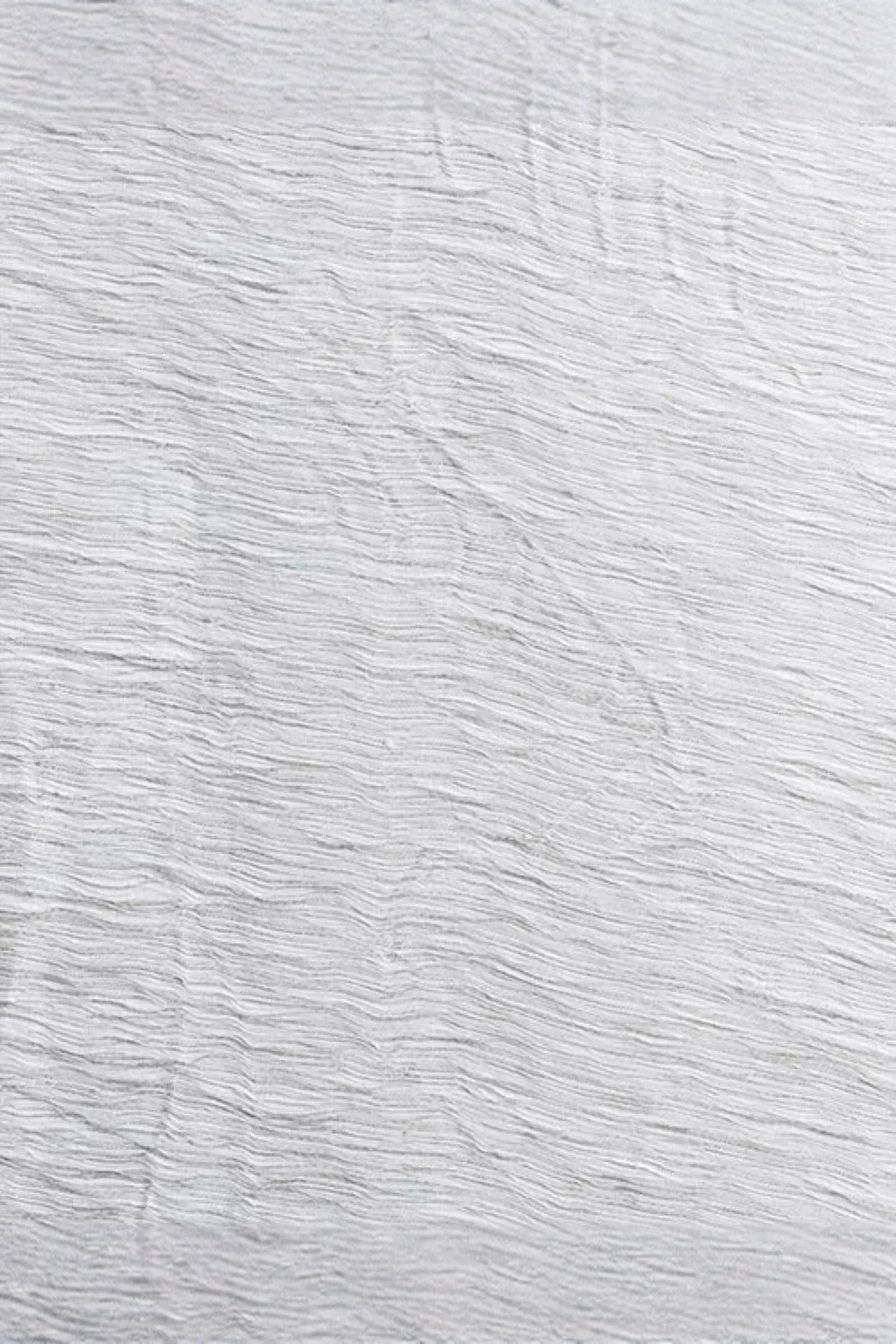 close-up of textured silver weave surface, subtle sculptural horizontal lines