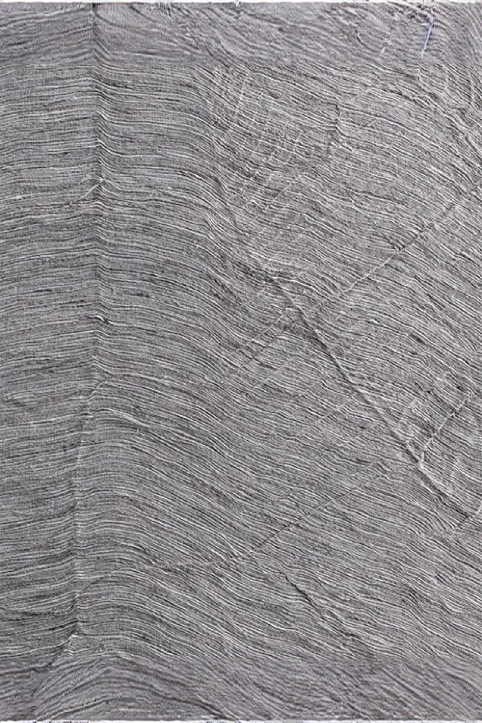 Textured basalt surface with fine horizontal striations, ideal for luxury interiors