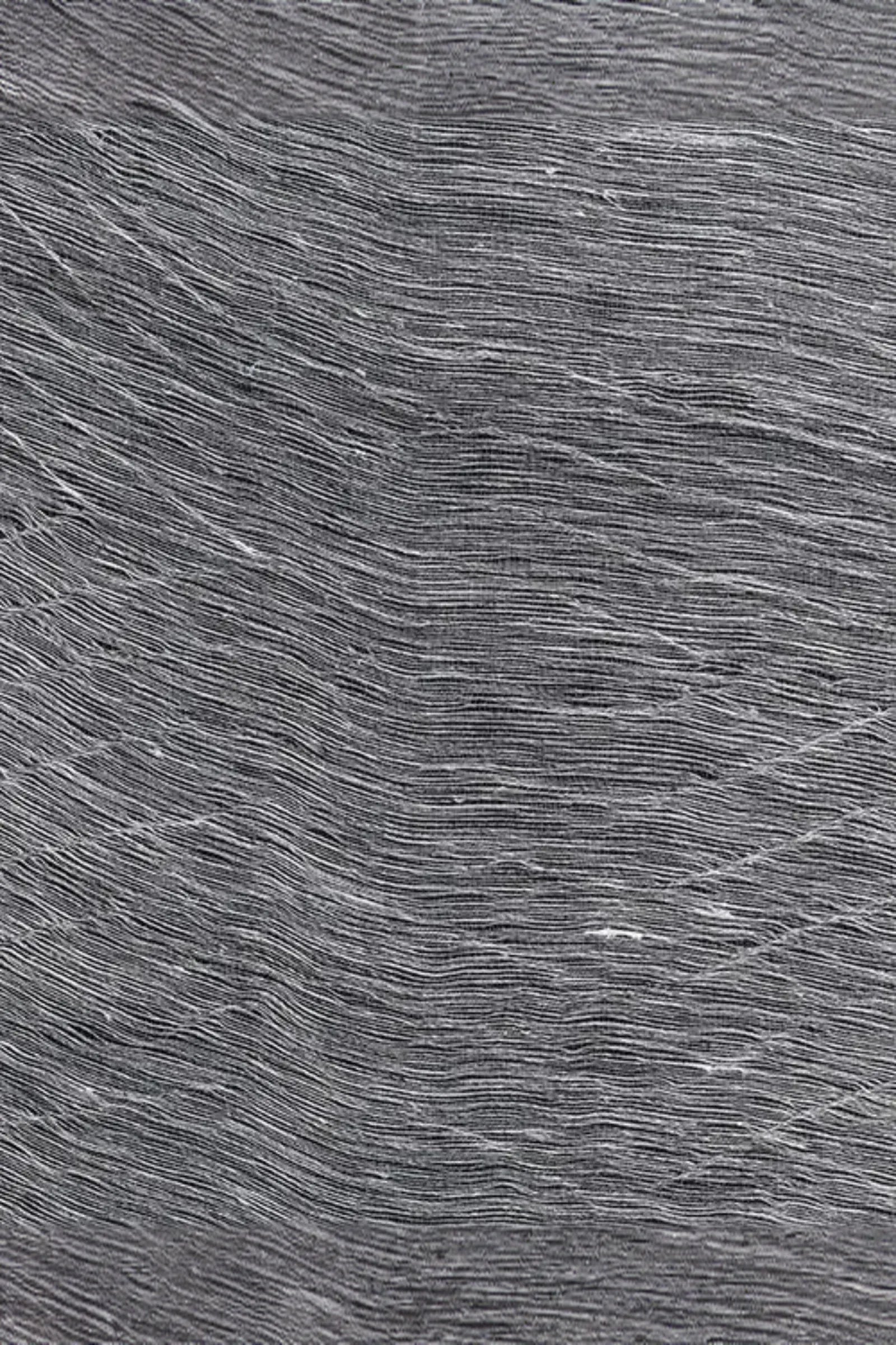 Charcoal gray textile fabric with fine sculptural wavy lines and textured weave pattern