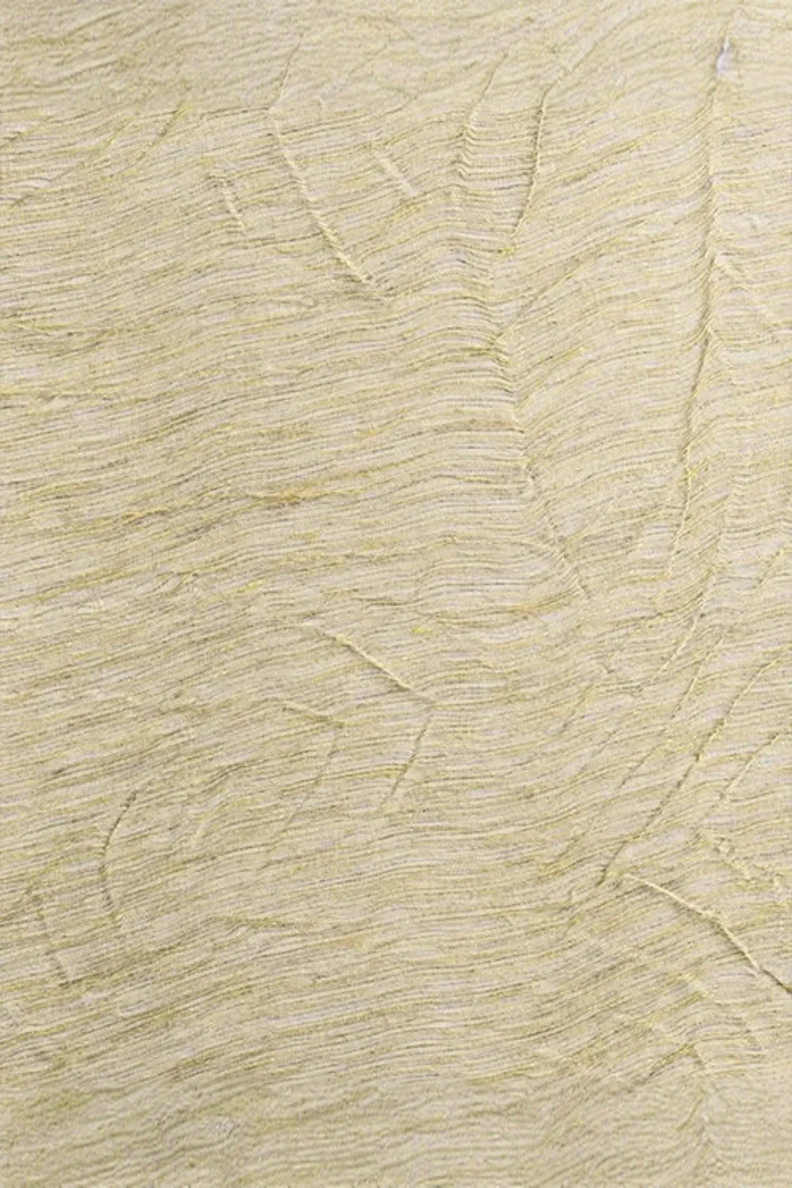 Close-up of textured beige woven fabric with subtle raised linear patterns