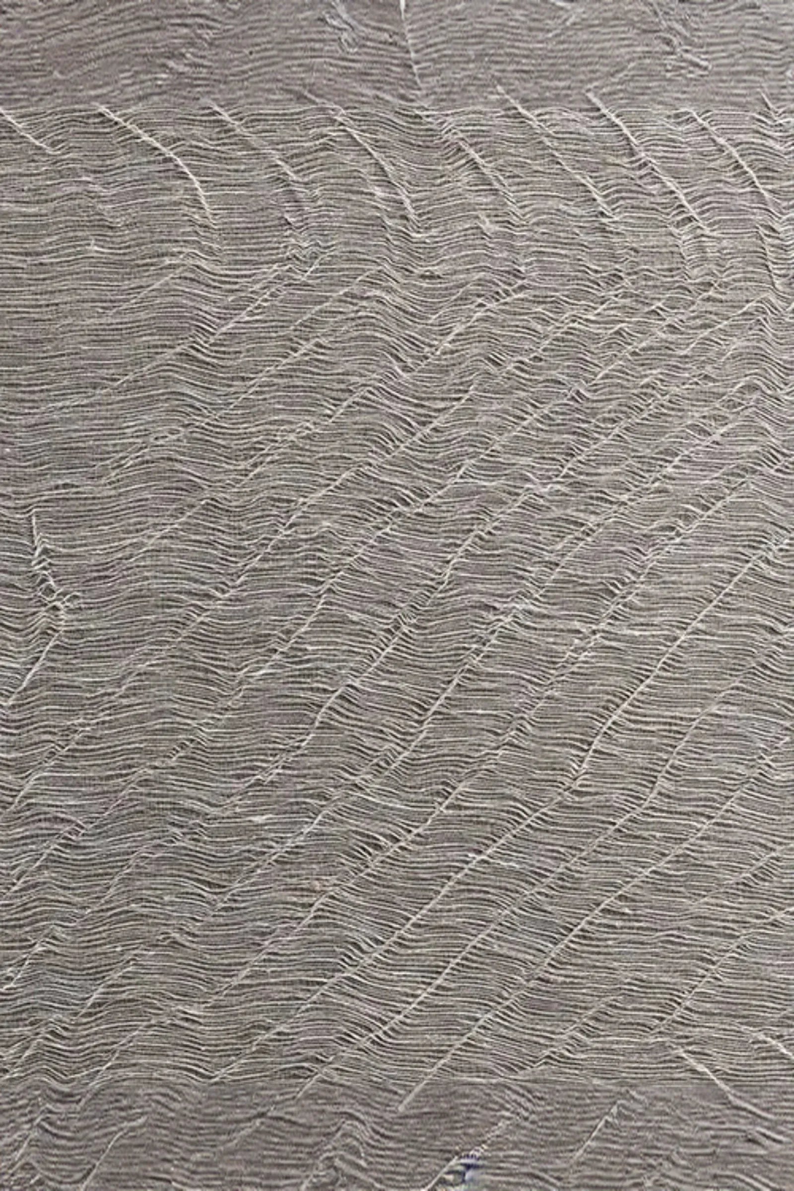 Textured sand-colored fabric with wavy, sculpted woven pattern for luxury interiors