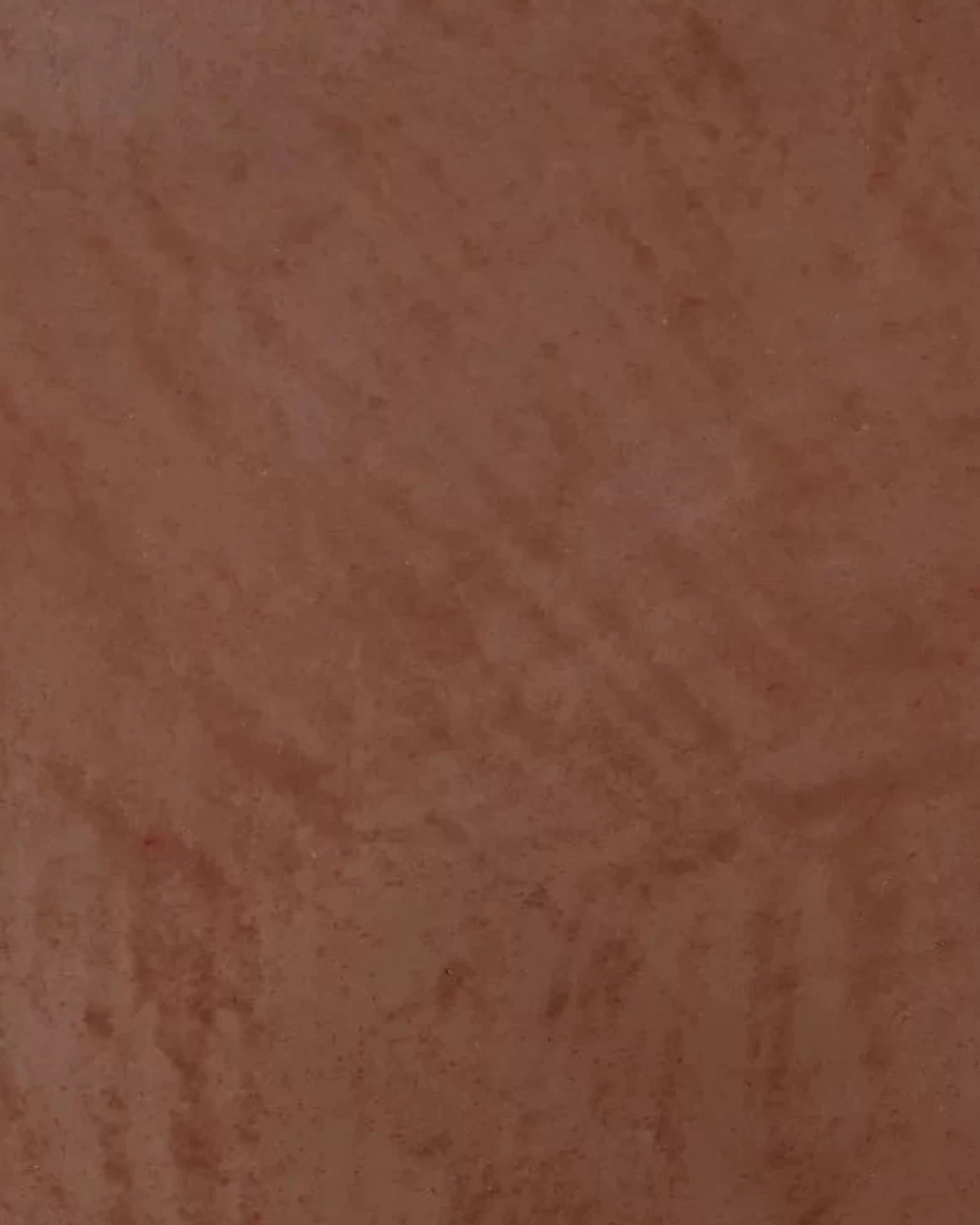 Uluru brown textured surface with subtle natural pattern, ideal for luxury interiors