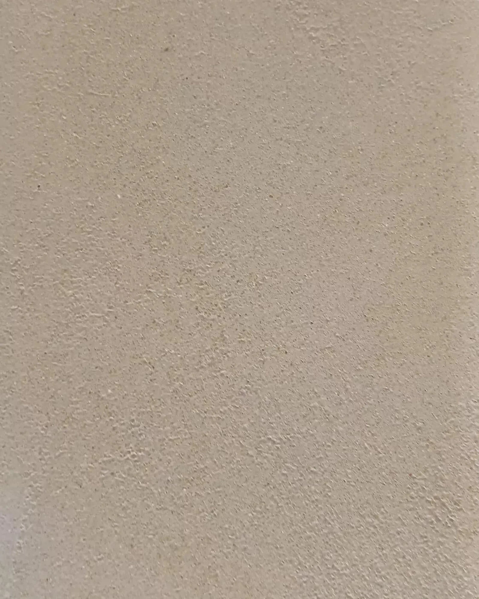 Beige textured plaster wall surface for luxury residential interiors