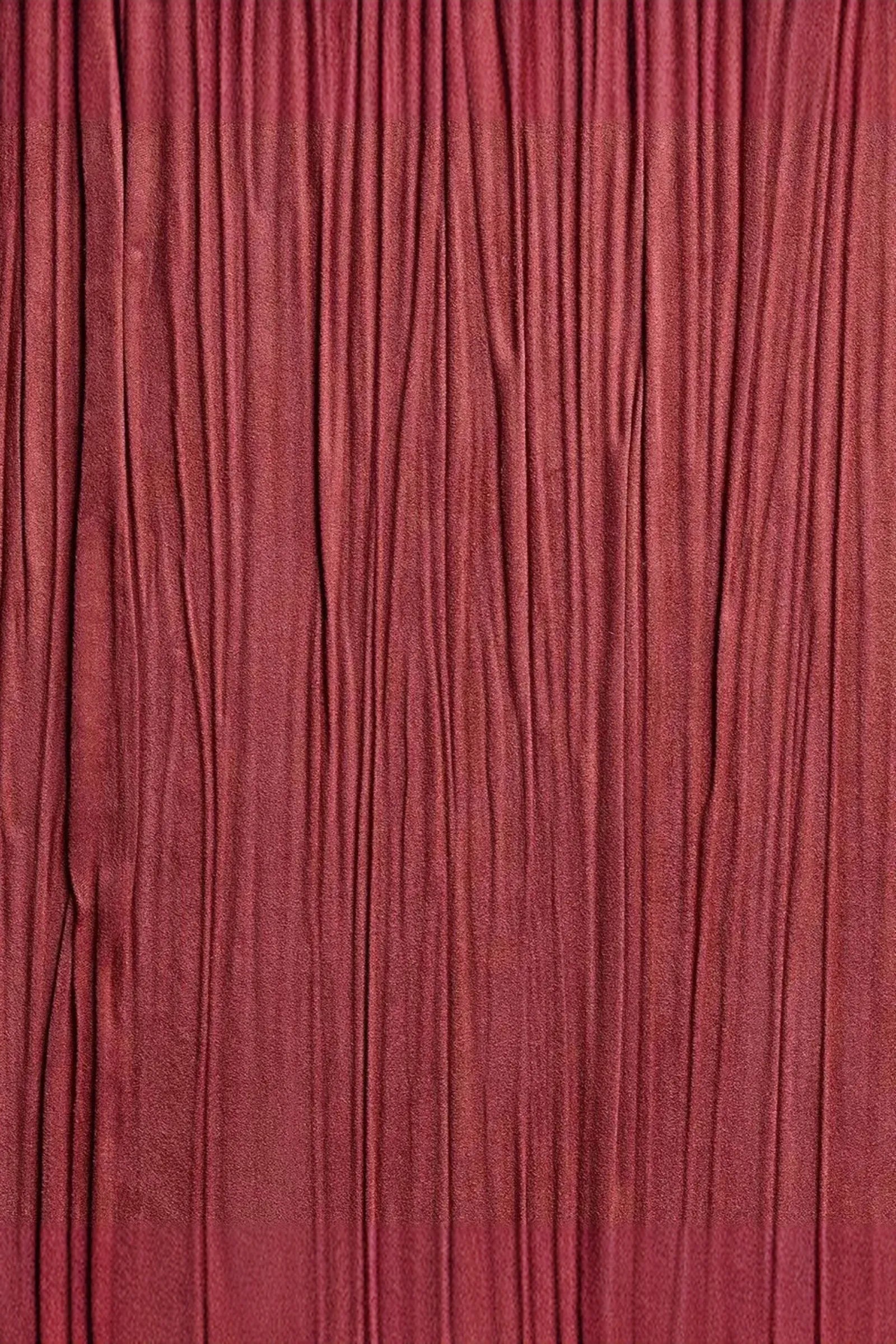 Textured red pleated fabric with vertical folds, ideal for luxury interior design